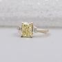 Lab grown radiant yellow diamond engagement ring with side stones