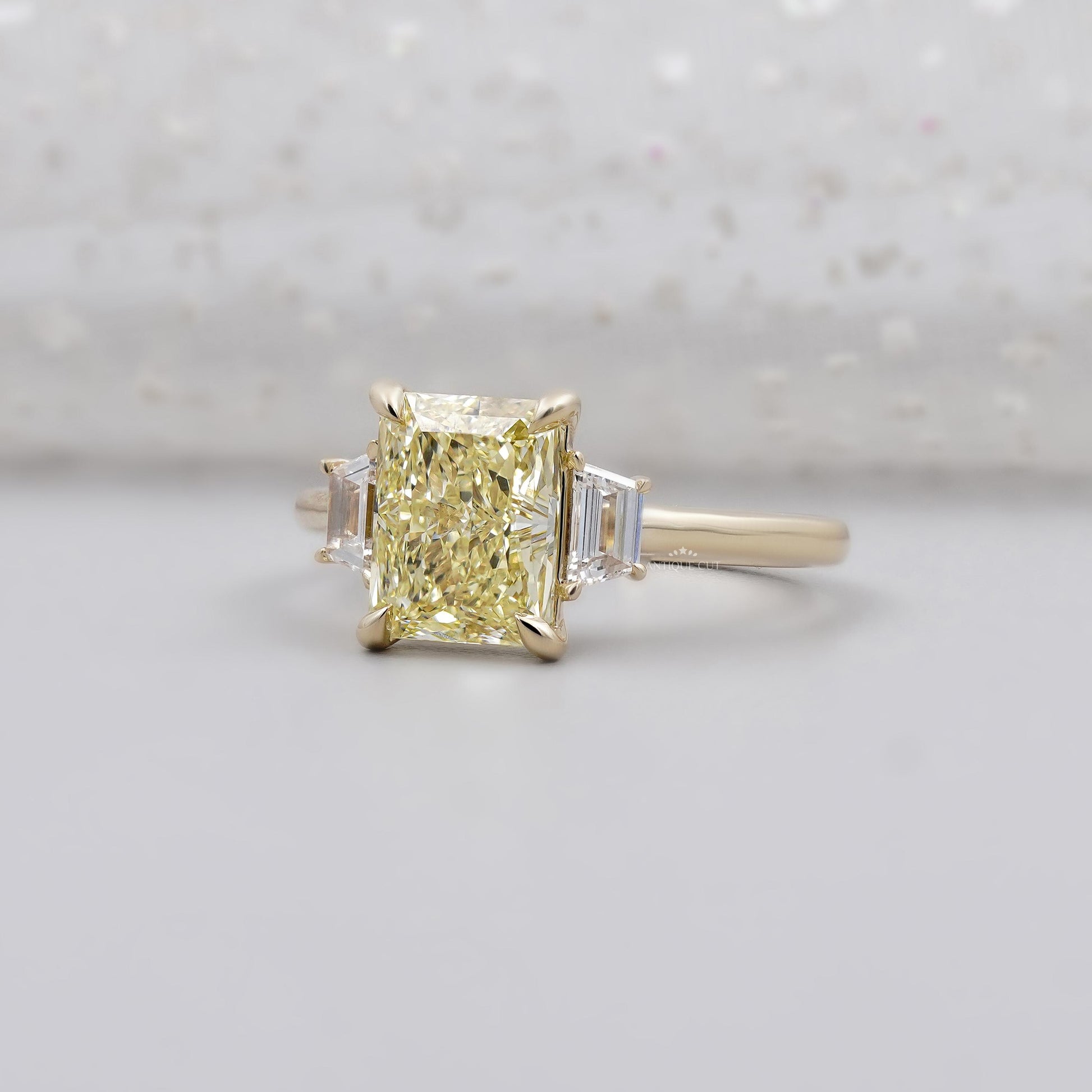 Lab grown radiant yellow diamond engagement ring with side stones