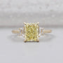 Radiant Fancy Yellow Diamond With Trapezoid Side Stone Ring IGI Certified