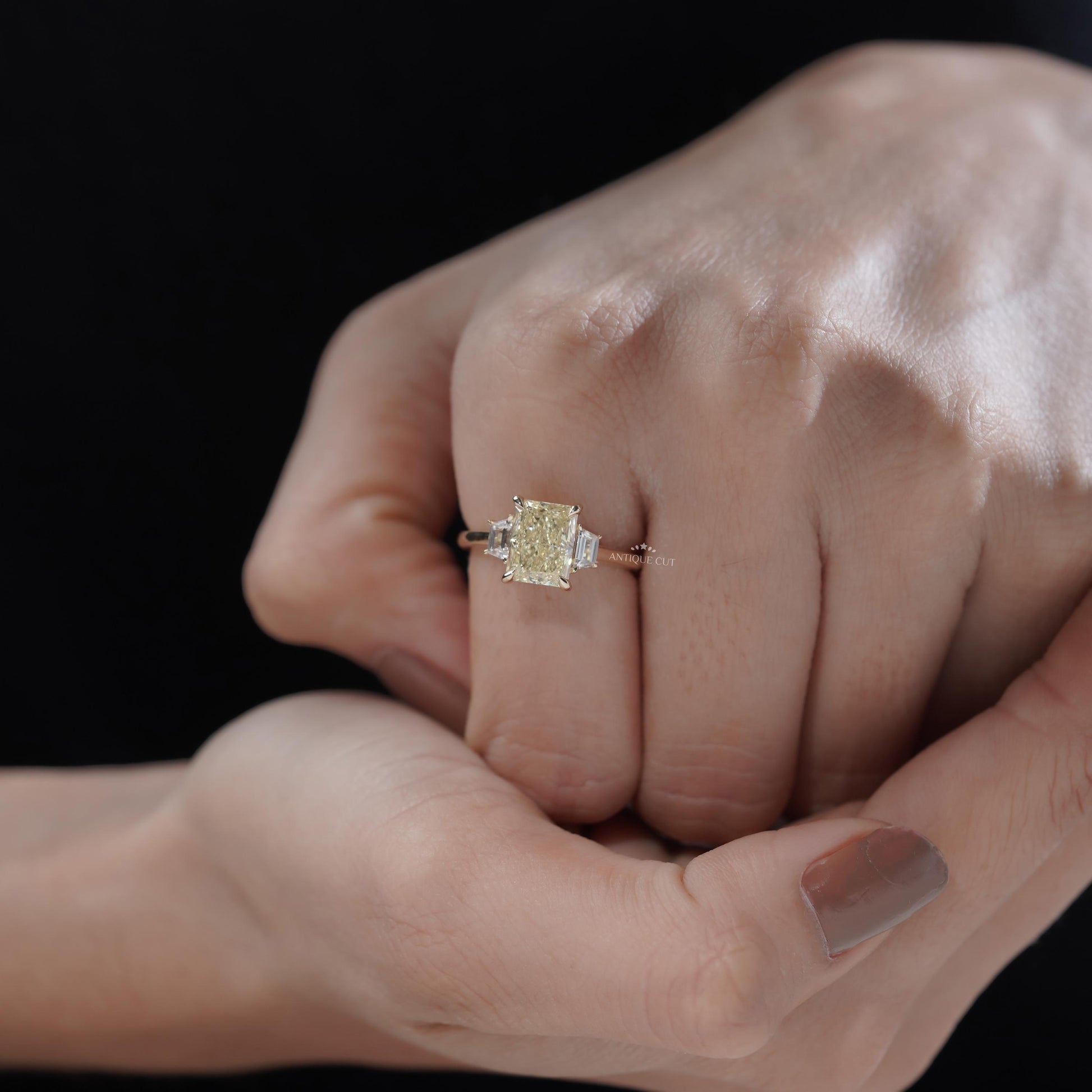 Luxury yellow gold radiant diamond ring with trapezoid sides