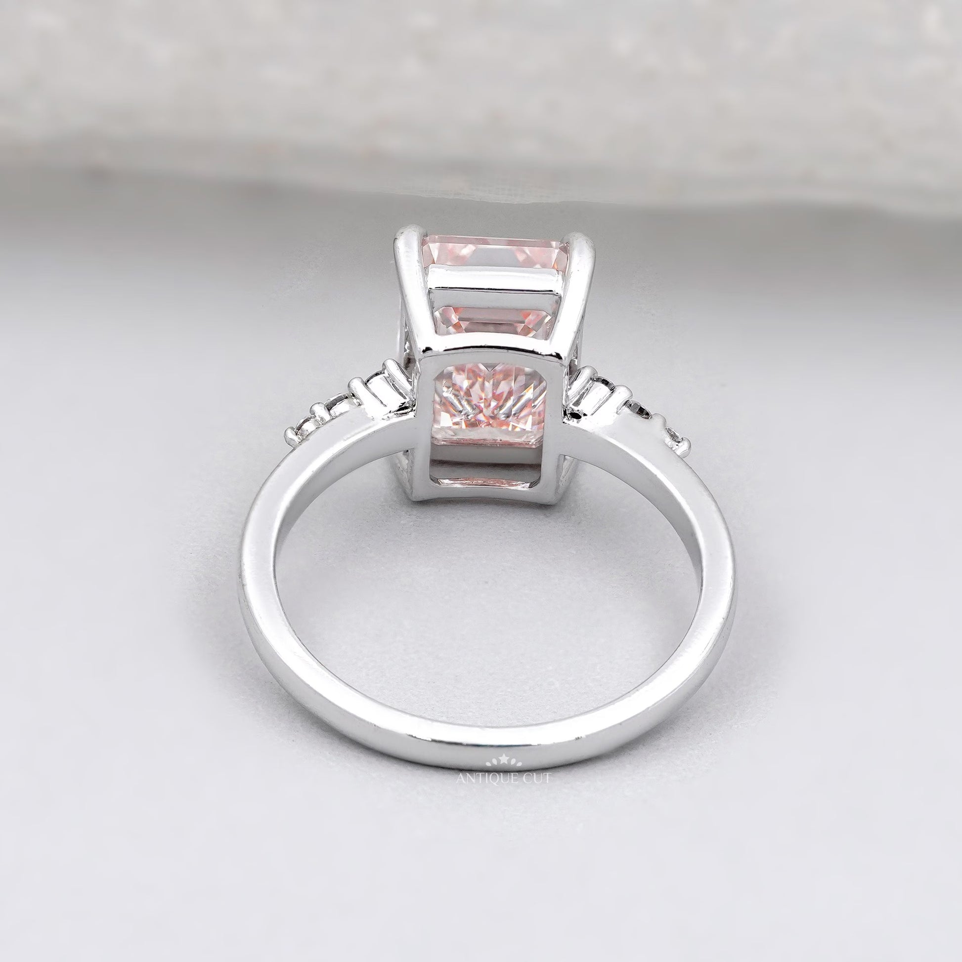 Lab grown emerald cut pink solitaire ring