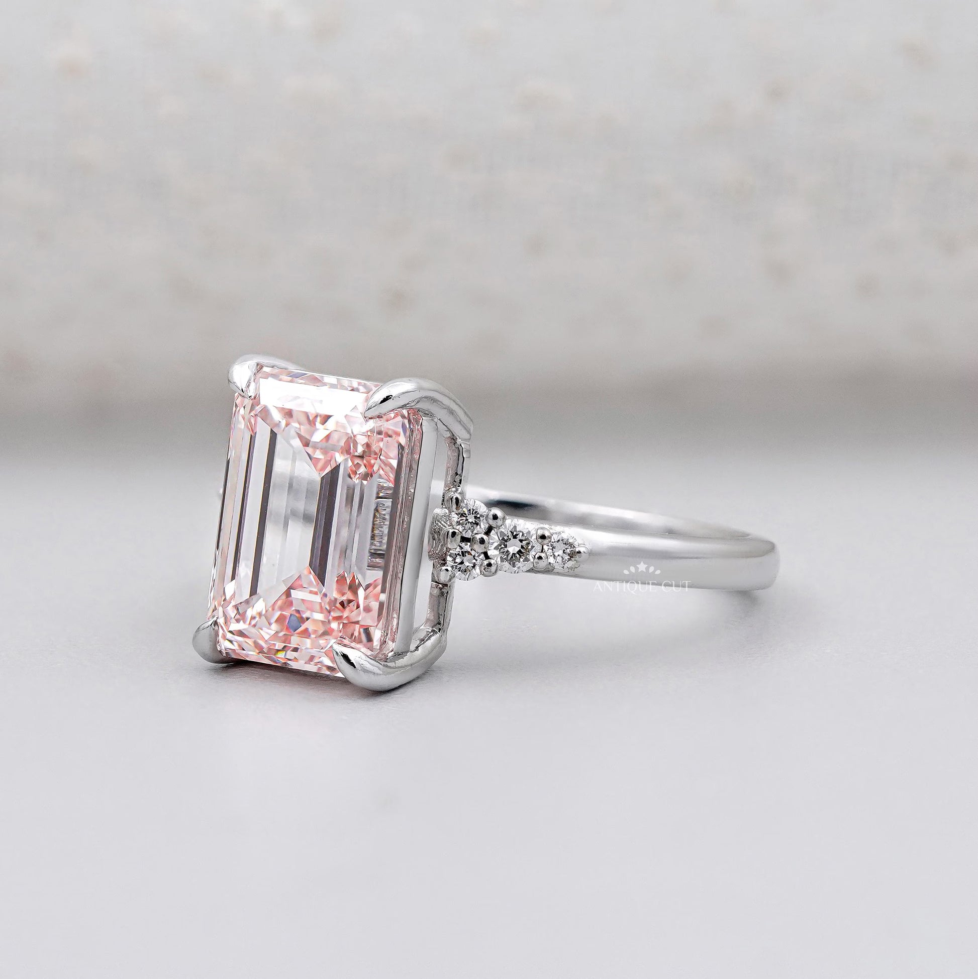 White gold emerald cut pink diamond ring
