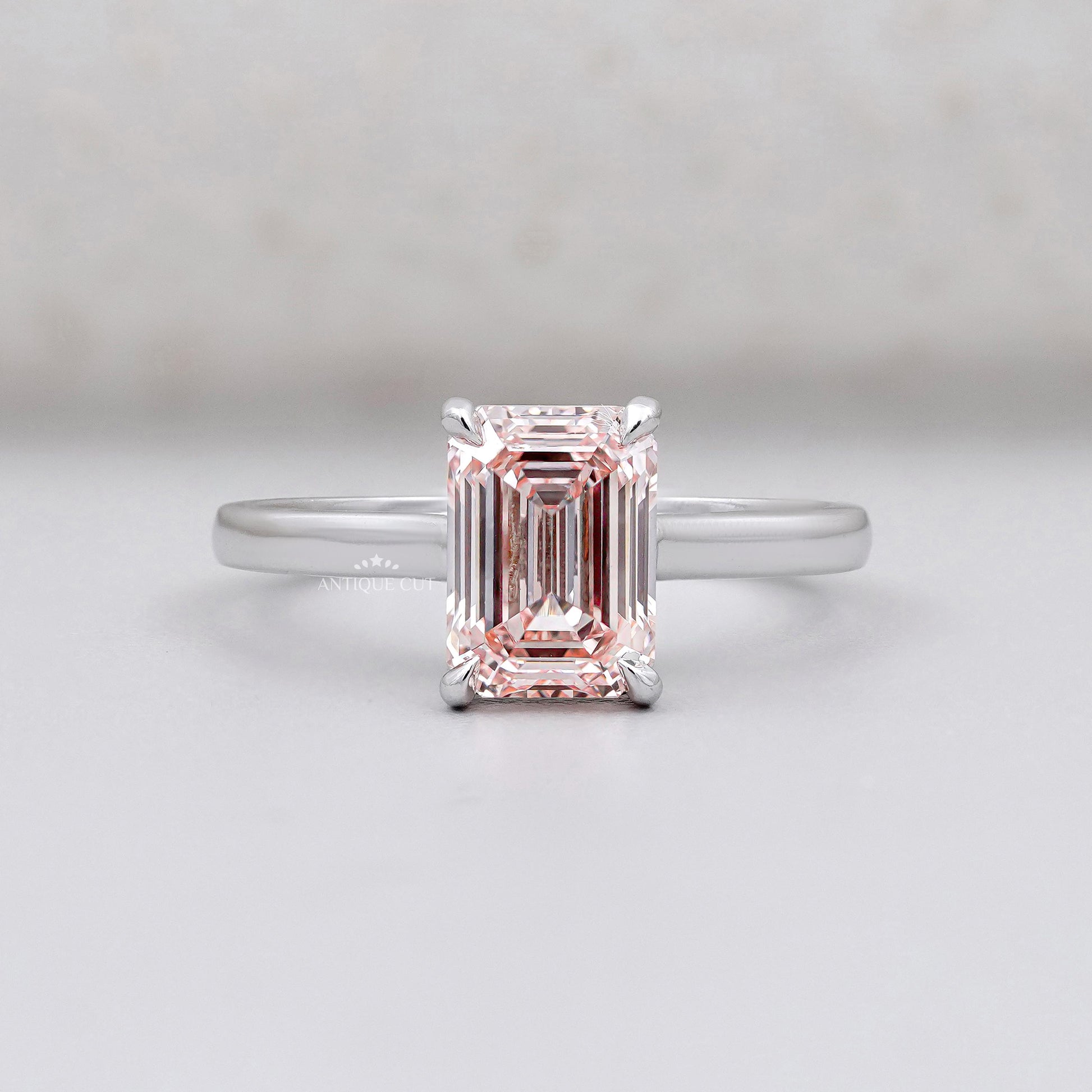 Modern emerald cut pink diamond solitaire ring in white gold