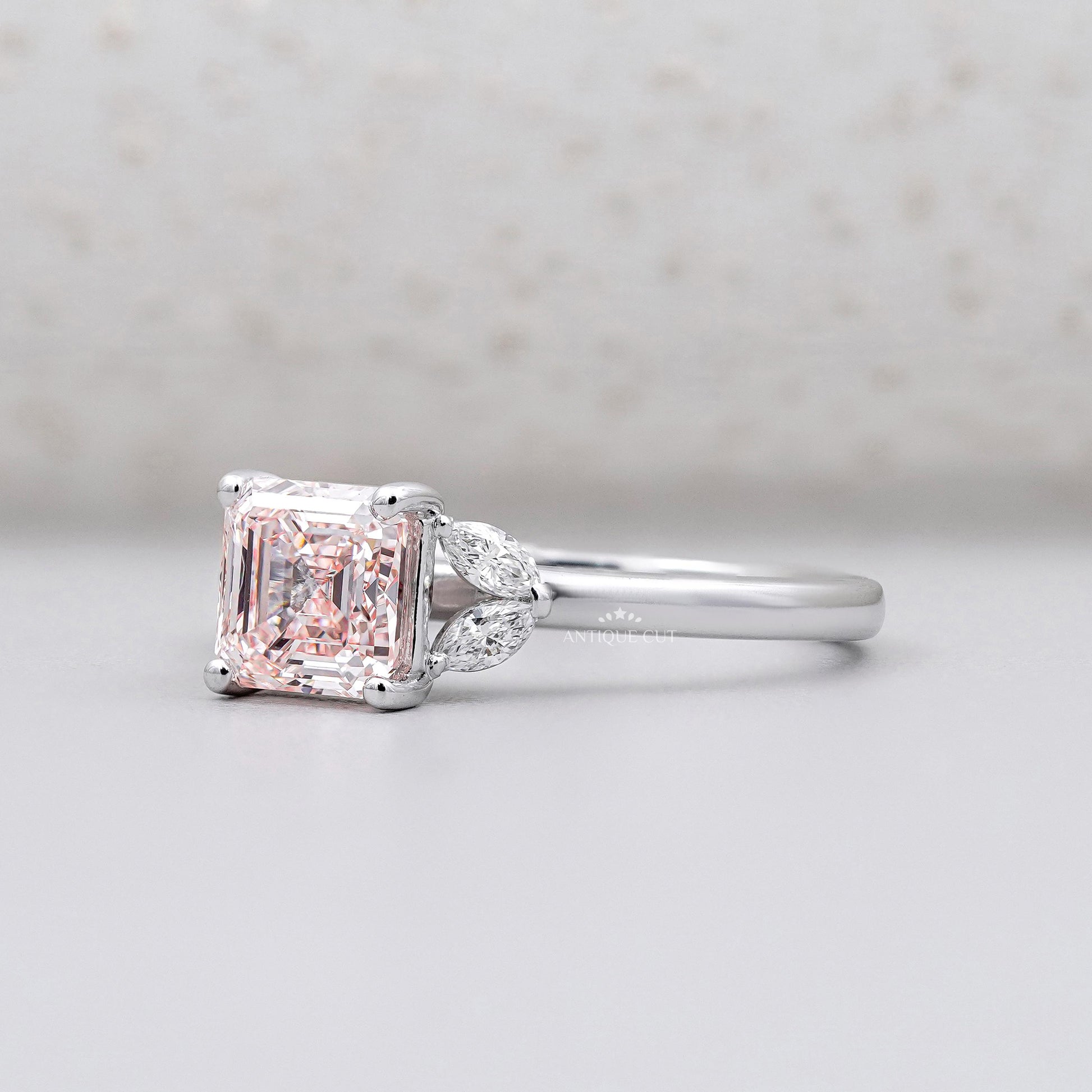 Lab grown Asscher cut diamond ring with marquise accents