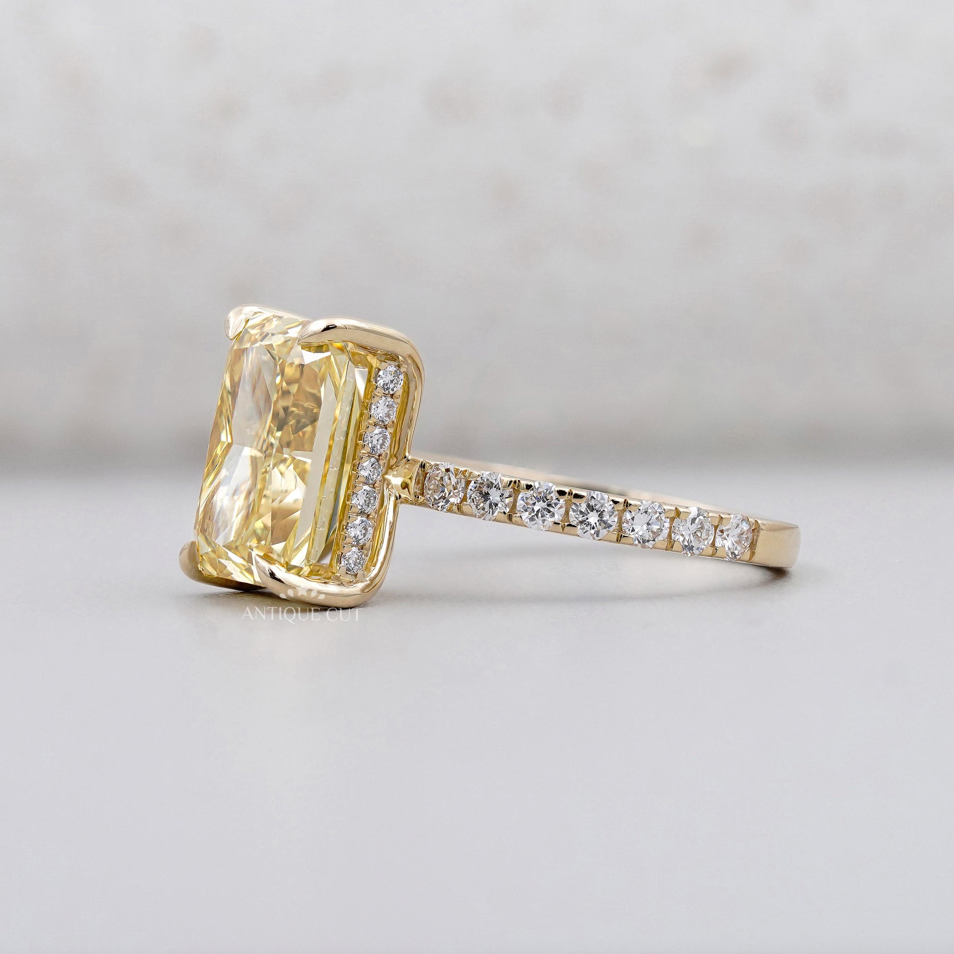 Yellow gold radiant fancy yellow diamond engagement ring