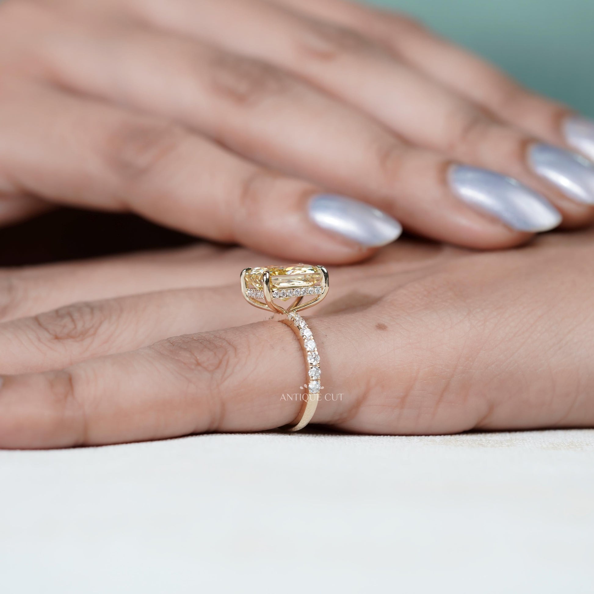Modern yellow gold radiant fancy yellow diamond ring