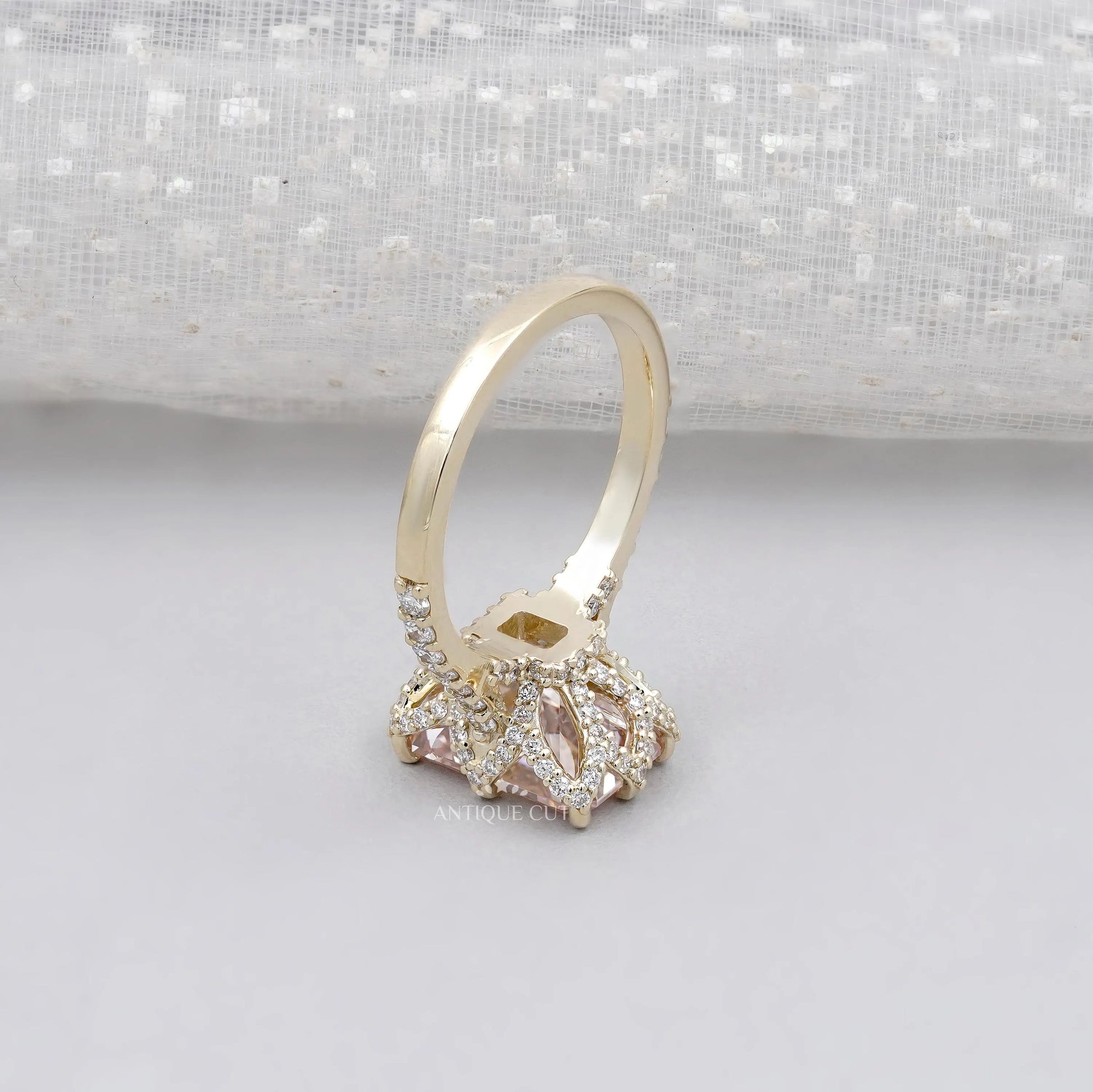 Elegant radiant pink diamond ring with hidden halo setting