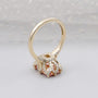 Pink radiant cut diamond engagement ring with hidden halo