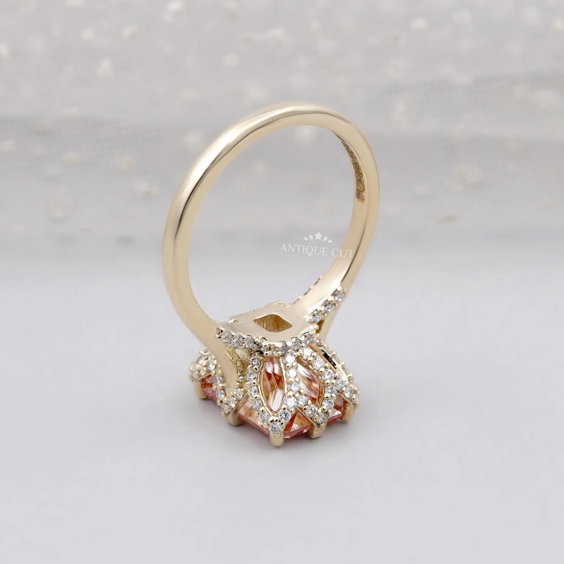 Pink radiant cut diamond engagement ring with hidden halo
