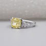 Fancy yellow cushion diamond ring in white gold setting