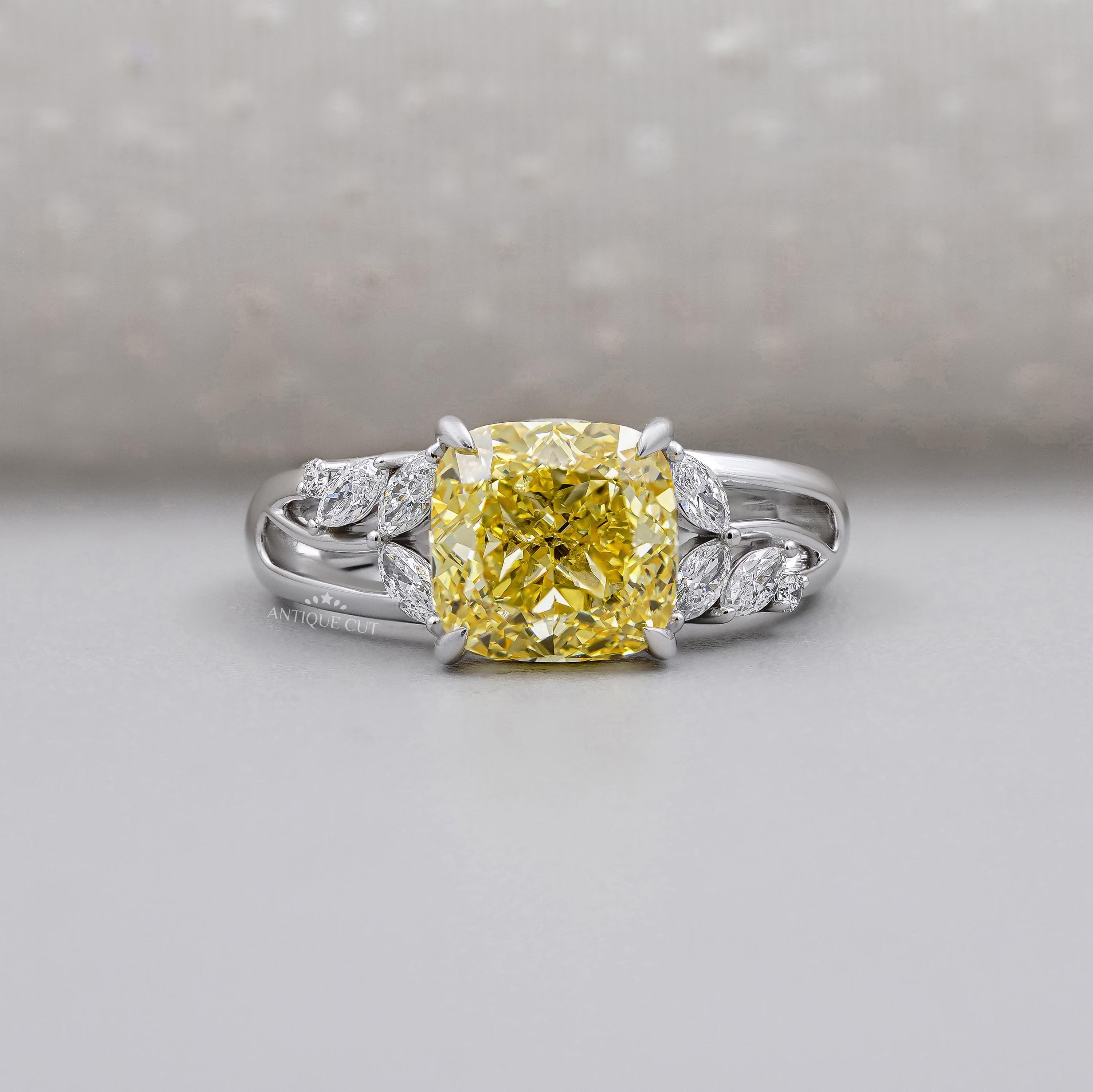 Yellow Cushion Cut Diamond Engagement Ring In White Gold With Marquise & Round Side Diamond IGI Certified