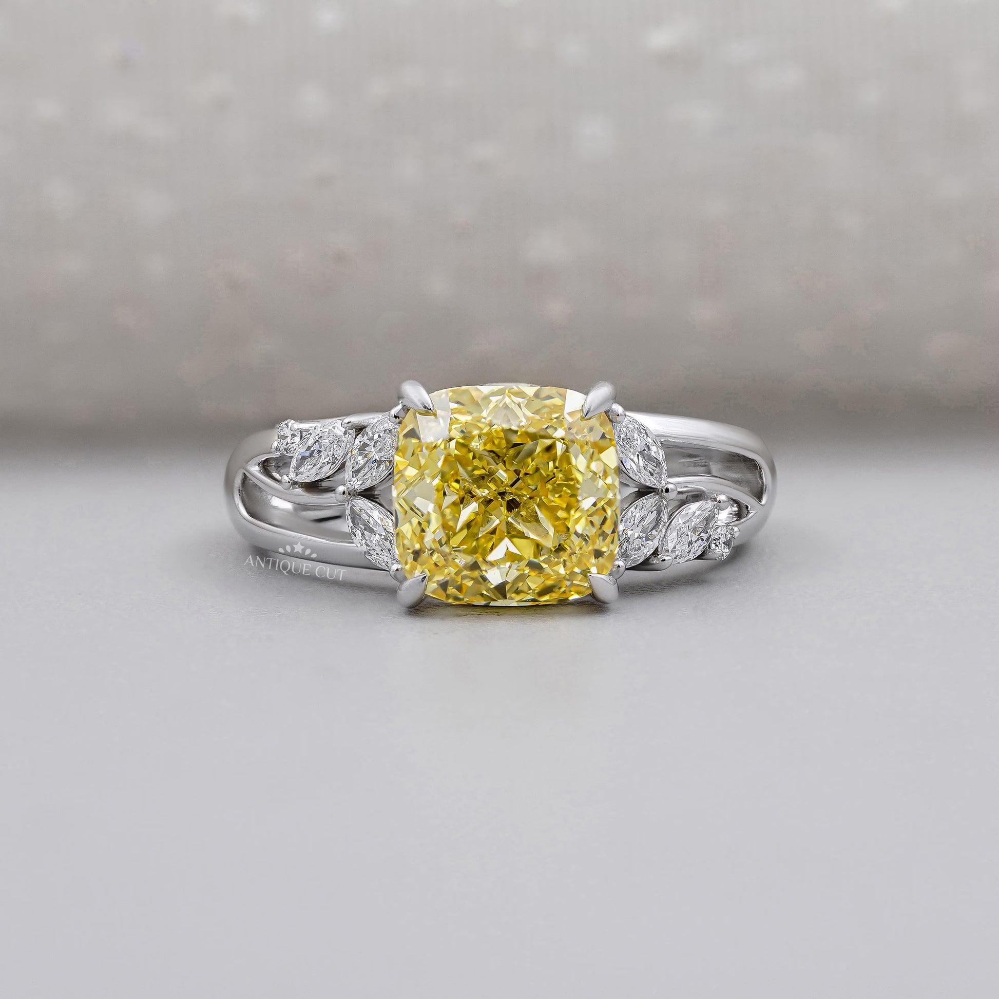 Yellow Cushion Cut Diamond Engagement Ring In White Gold With Marquise & Round Side Diamond IGI Certified