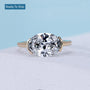 East West oval cut diamond engagement ring yellow gold