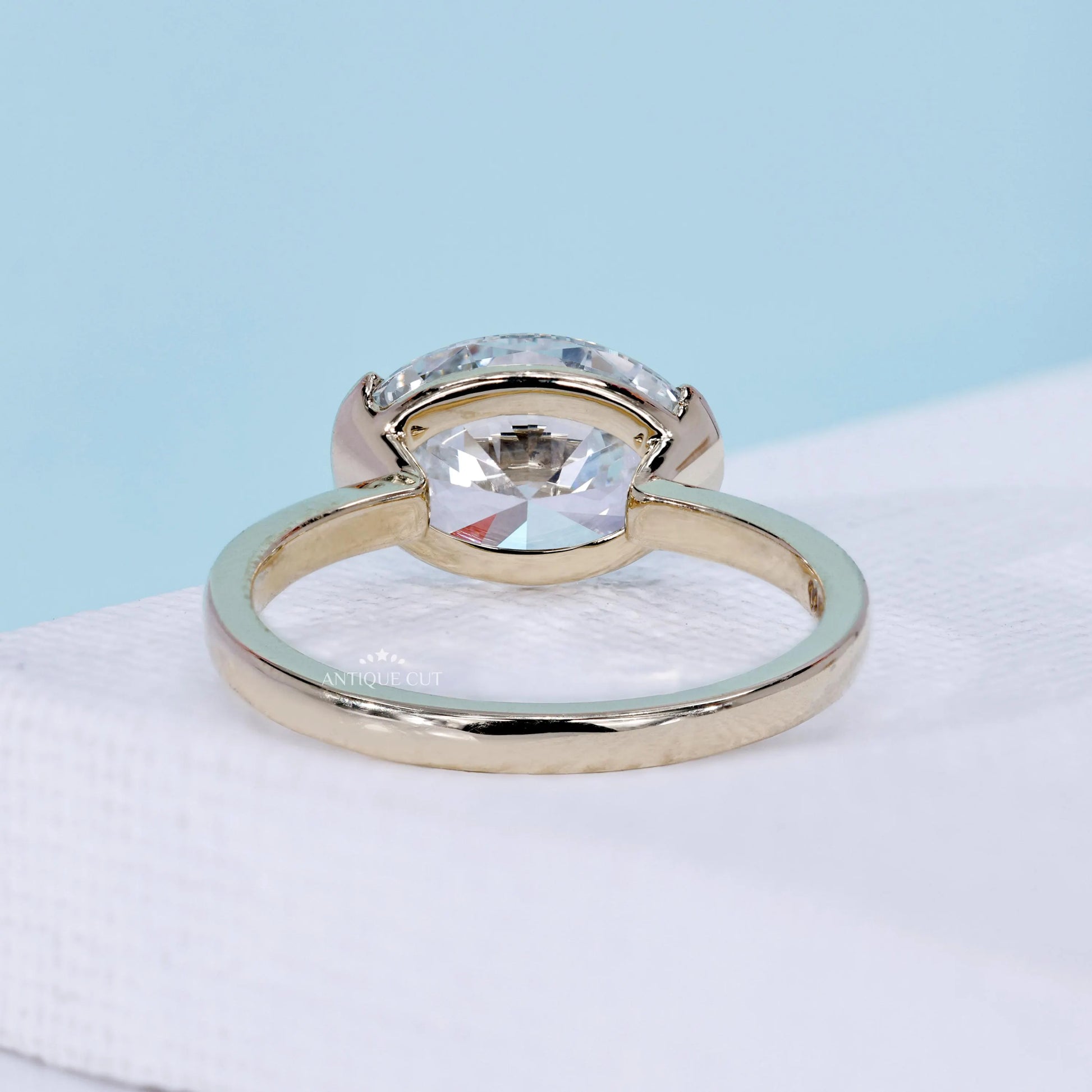 Yellow gold horizontal oval solitaire ring