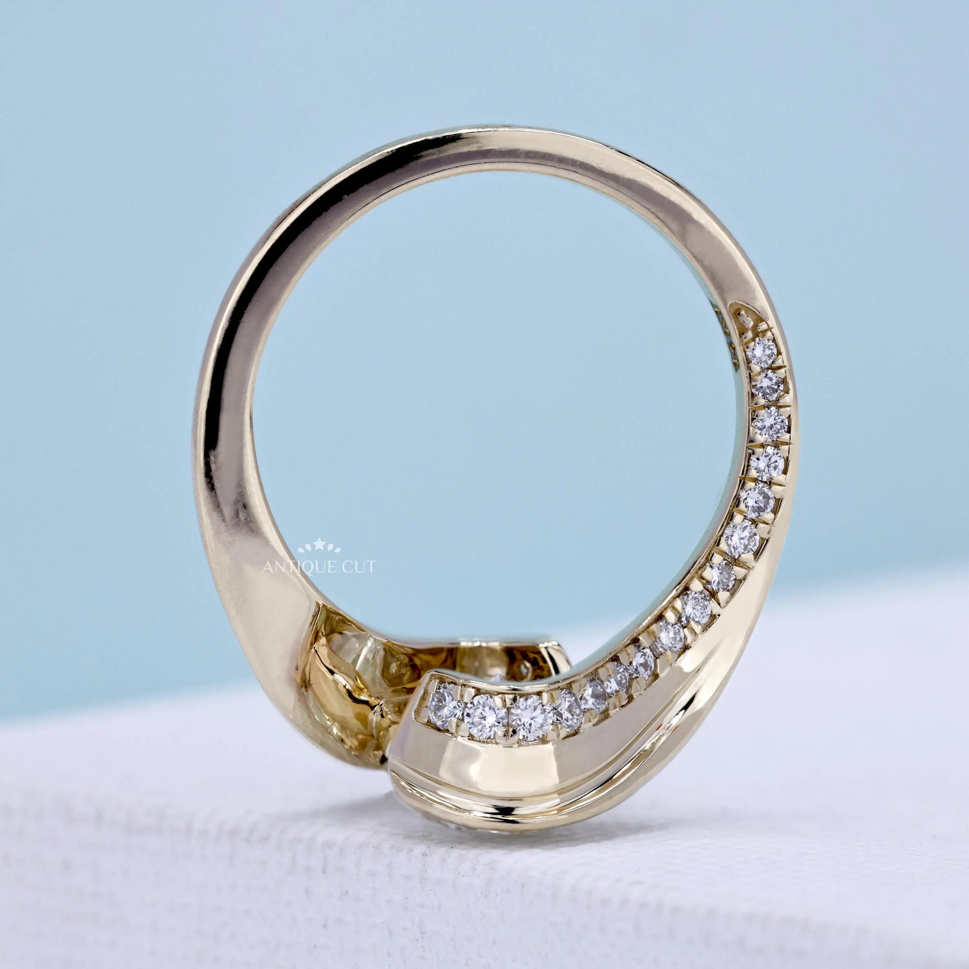 Yellow gold oval solitaire diamond bypass ring
