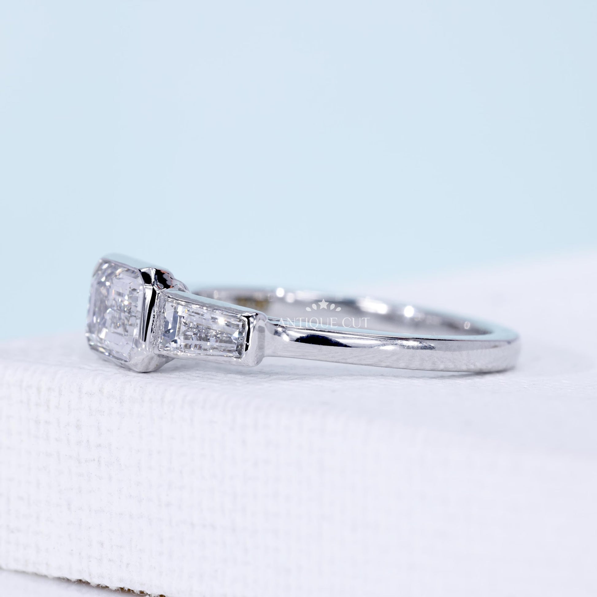 Emerald Cut Lab Grown Diamond Three Stone Engagement Ring with Tapered Baguette Side Stones in White Gold