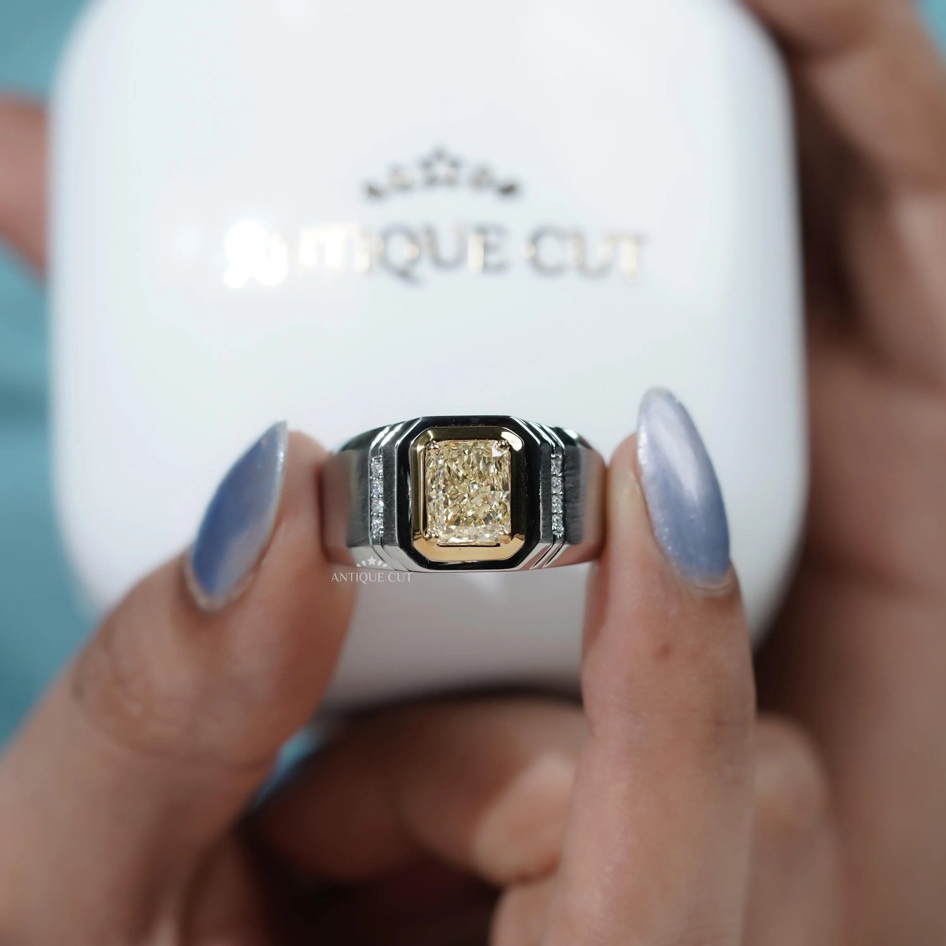 Proposal ring yellow cushion cut with side stones