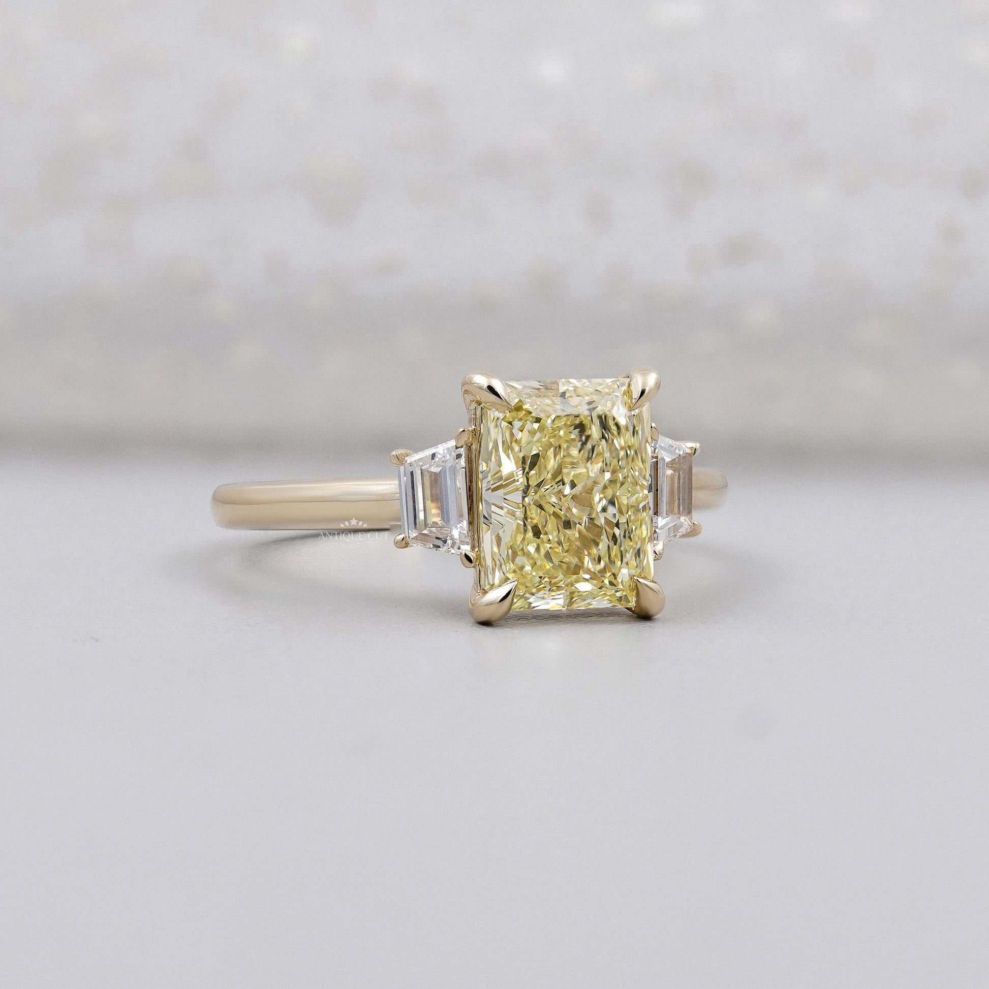 IGI certified radiant fancy yellow diamond ring
