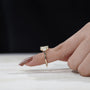 Modern yellow gold radiant diamond ring with side stones