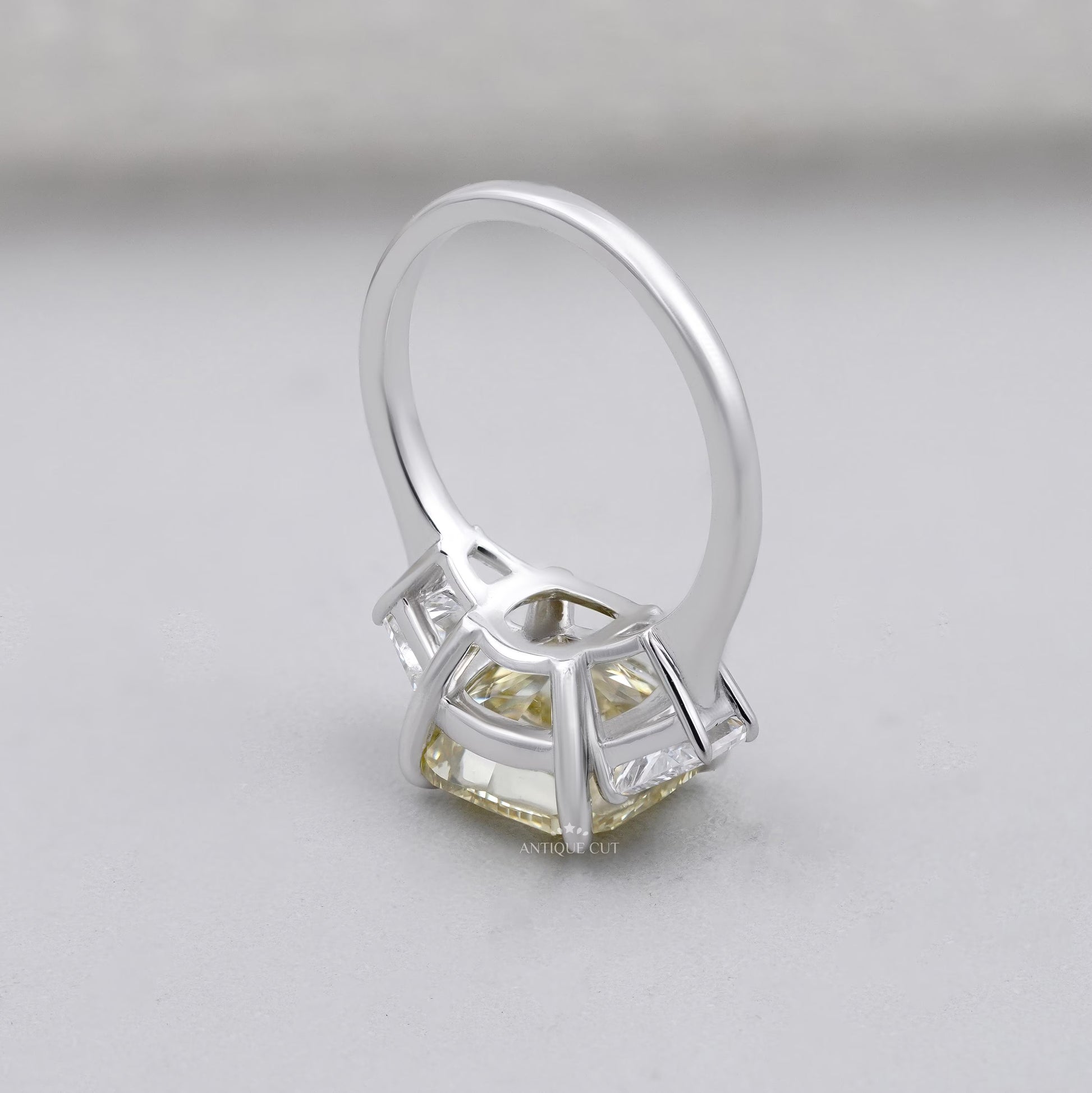 Lab grown cushion cut yellow diamond three stone ring
