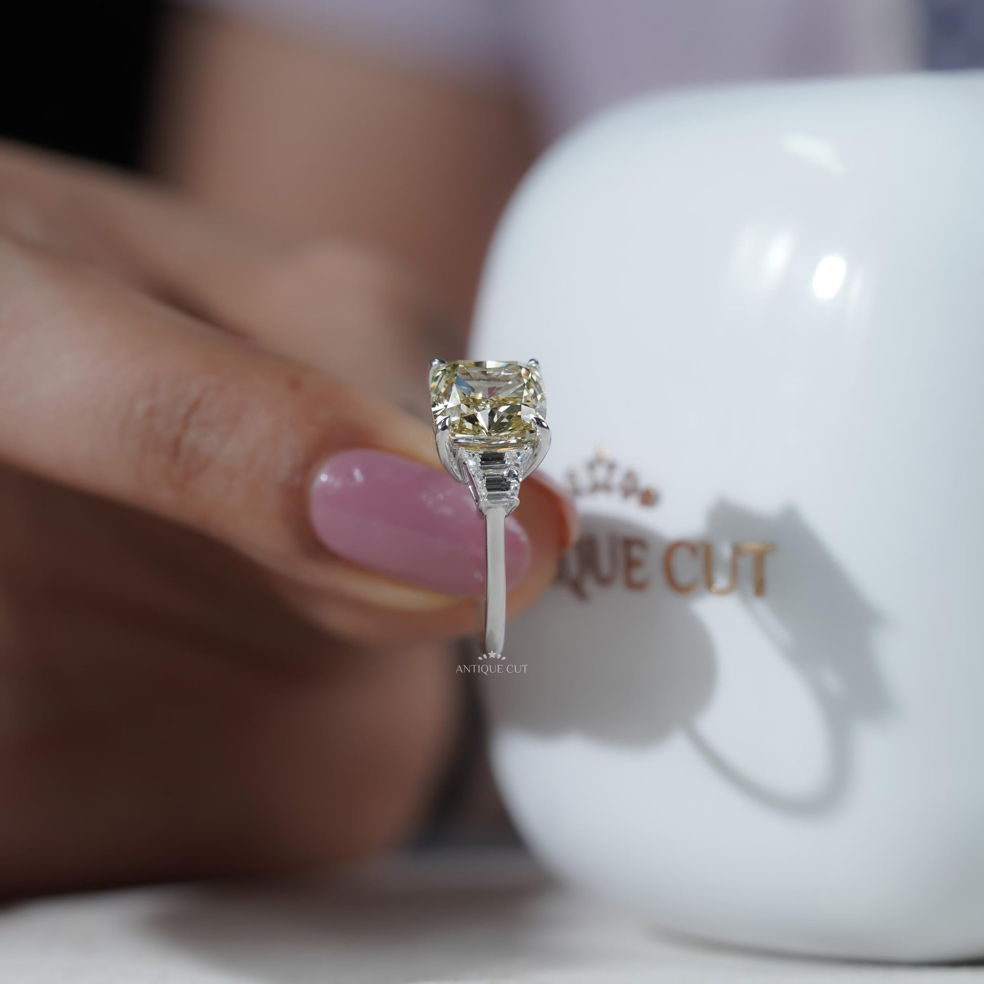 Contemporary white gold cushion cut diamond ring