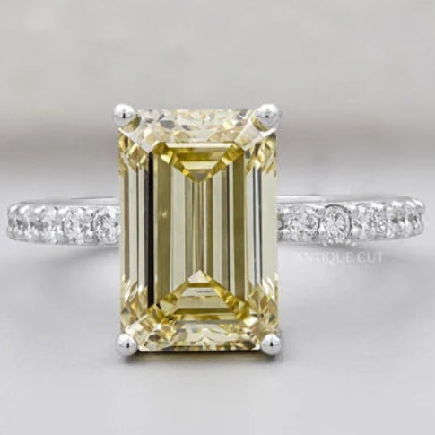 Emerald Cut Fancy Yellow Diamond Solitaire Ring with Round Pave Band