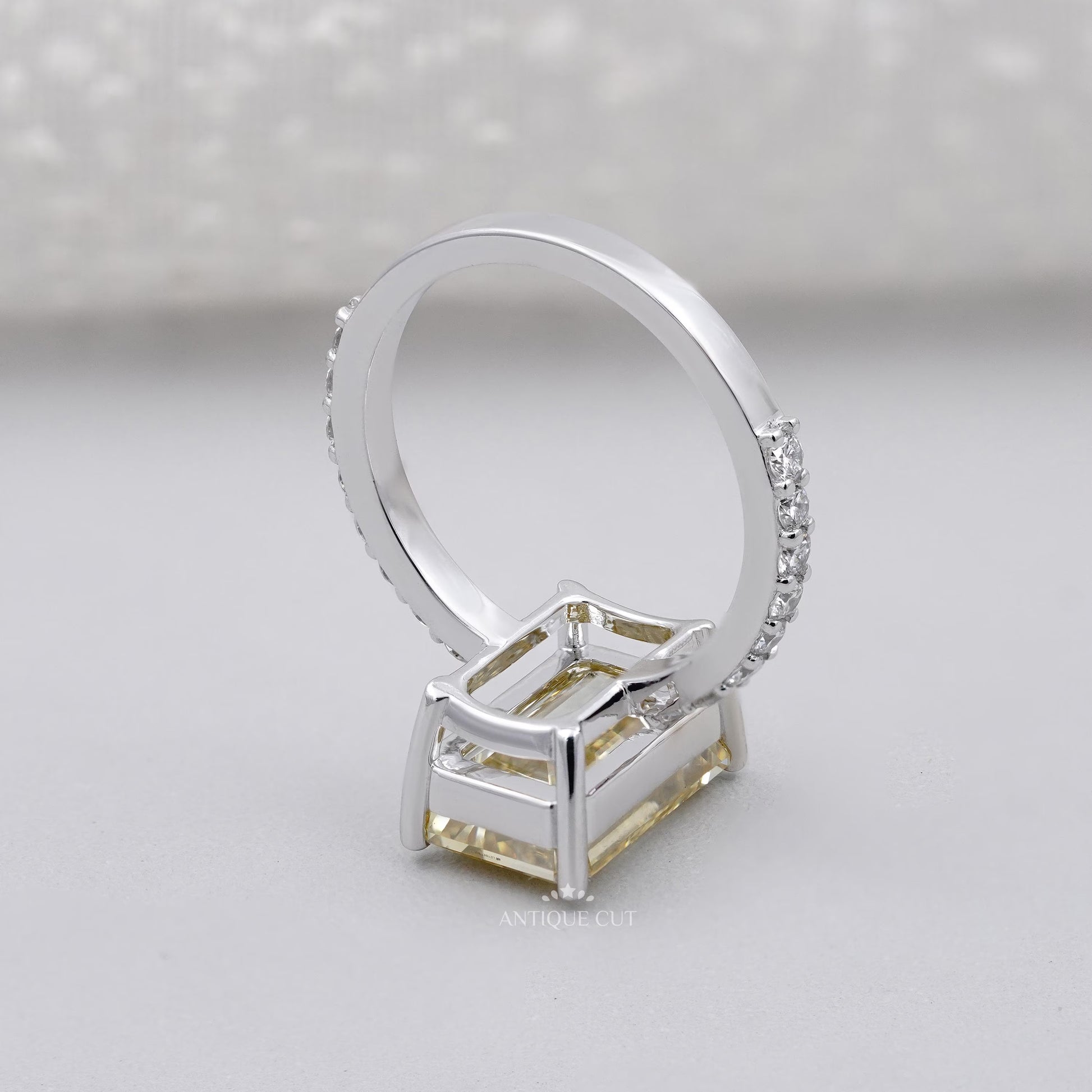 IGI Certified emerald cut fancy yellow diamond ring