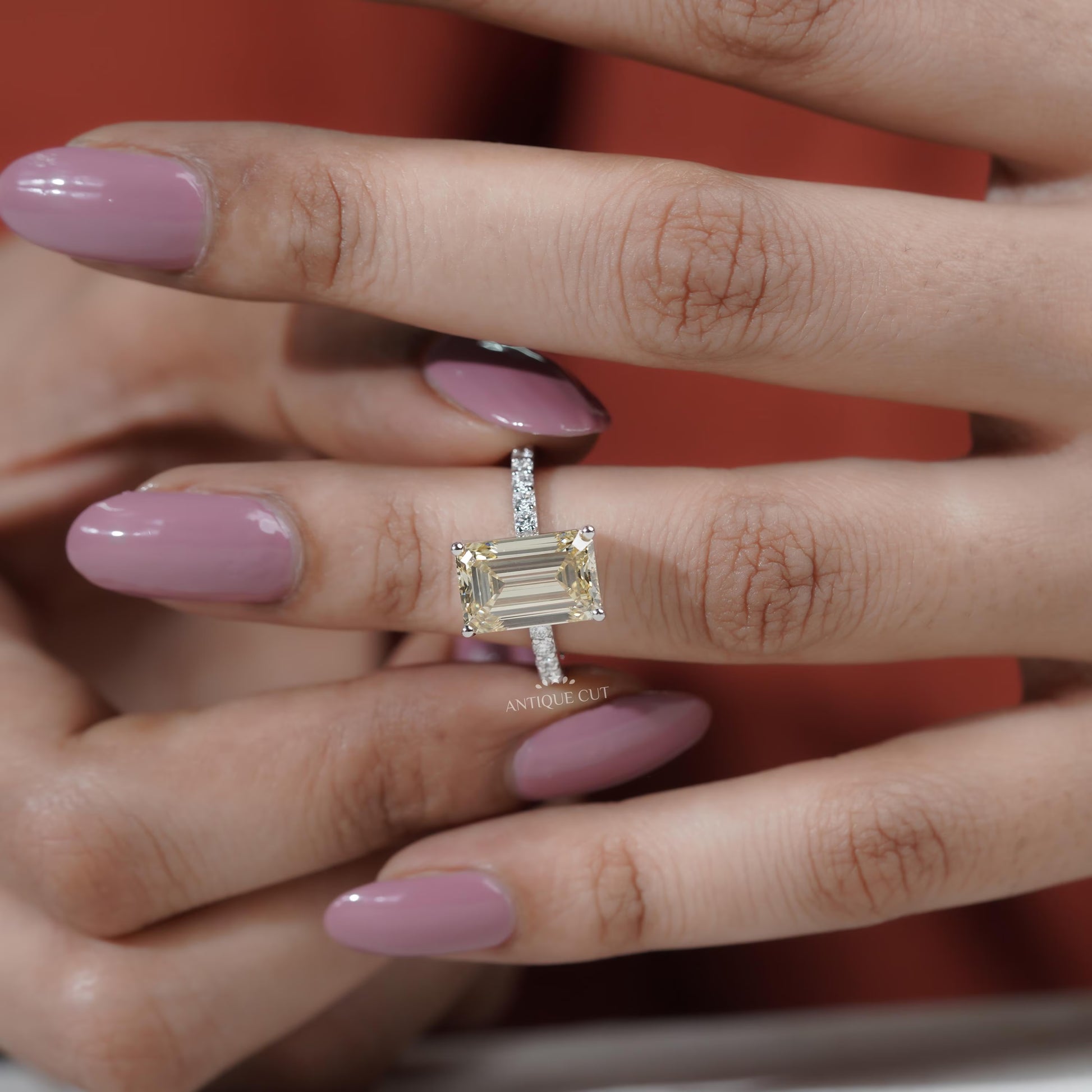Bridal ring emerald cut diamond with round pave band
