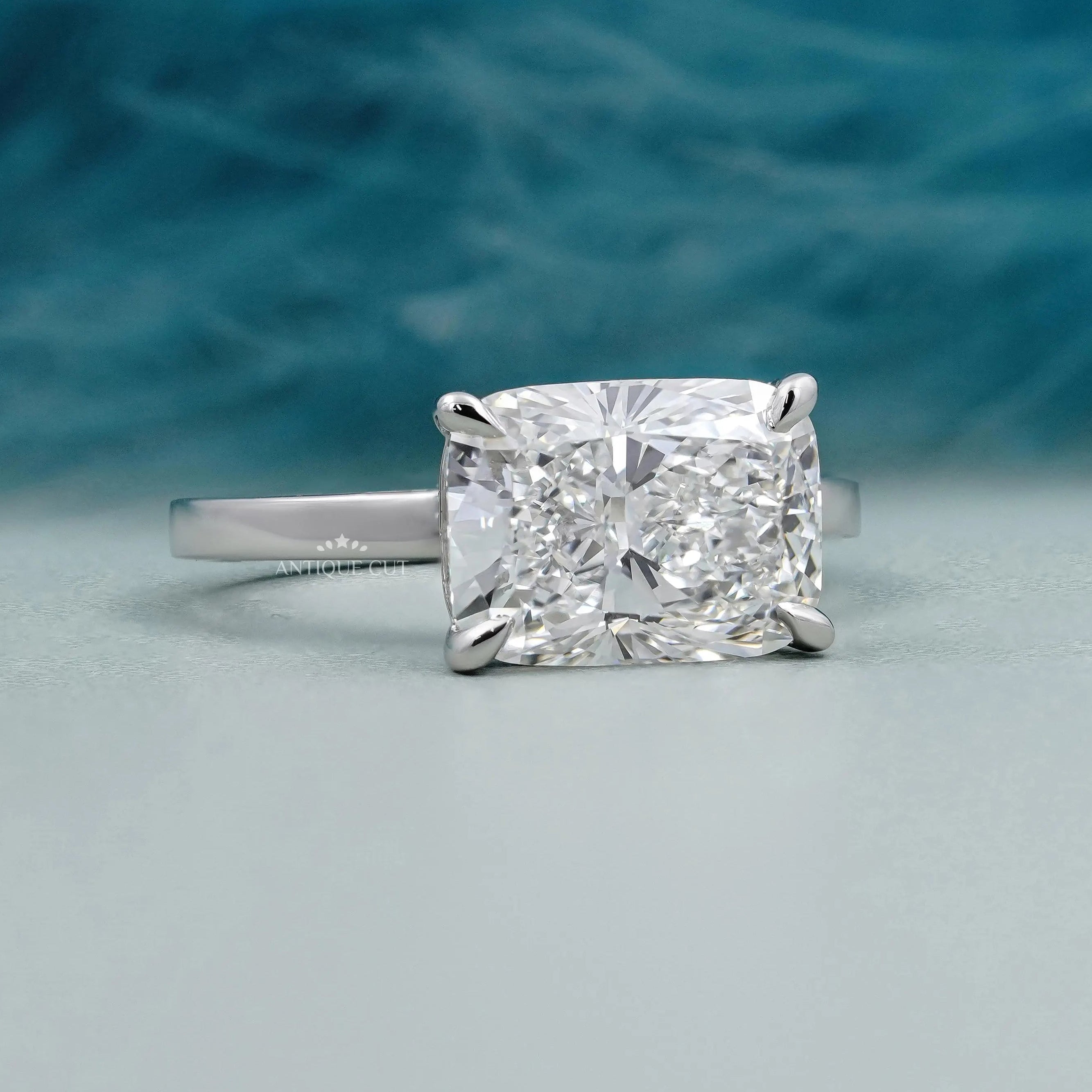 Cushion cut East West diamond solitaire engagement ring