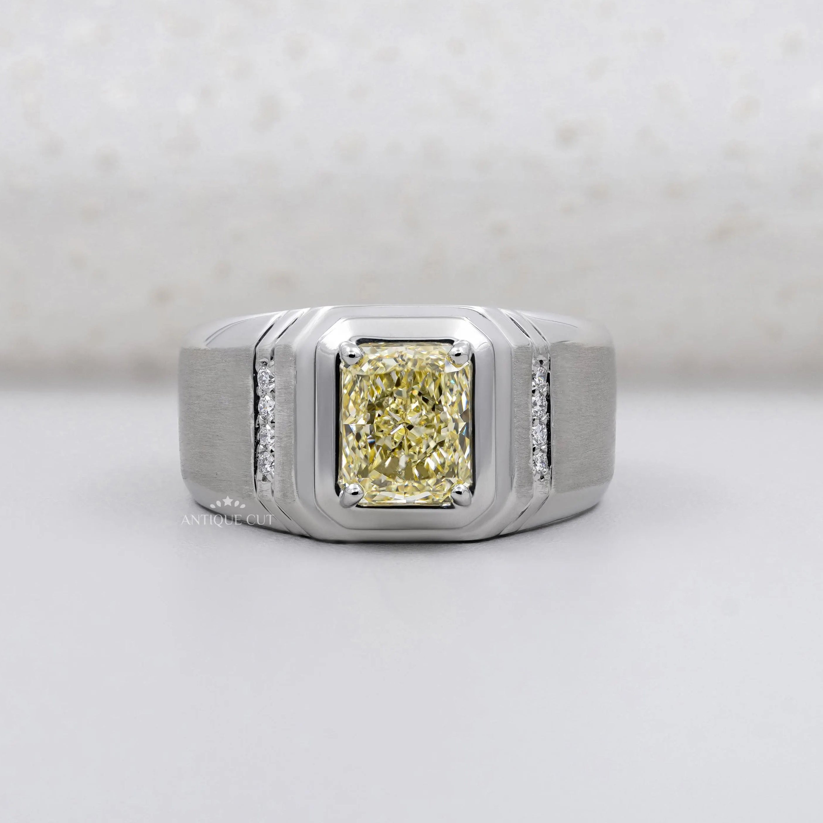 Radiant Cut Fancy Yellow Diamond Men's Ring Wide White Bezel & Round Side Stone IGI Certified