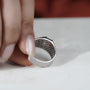 Radiant cut yellow diamond ring with wide white bezel