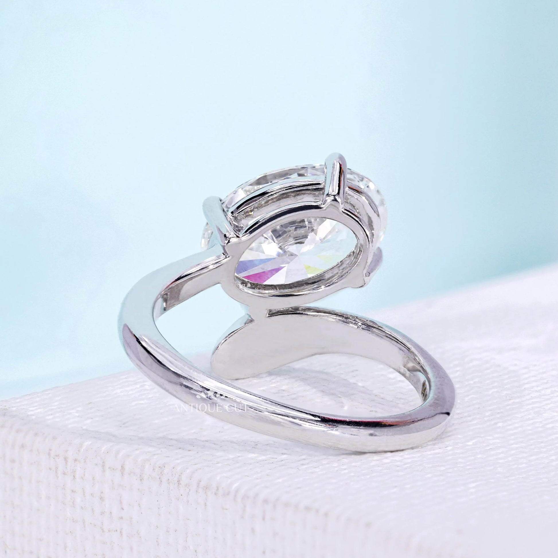 Lab grown oval diamond ring with elegant bypass band design