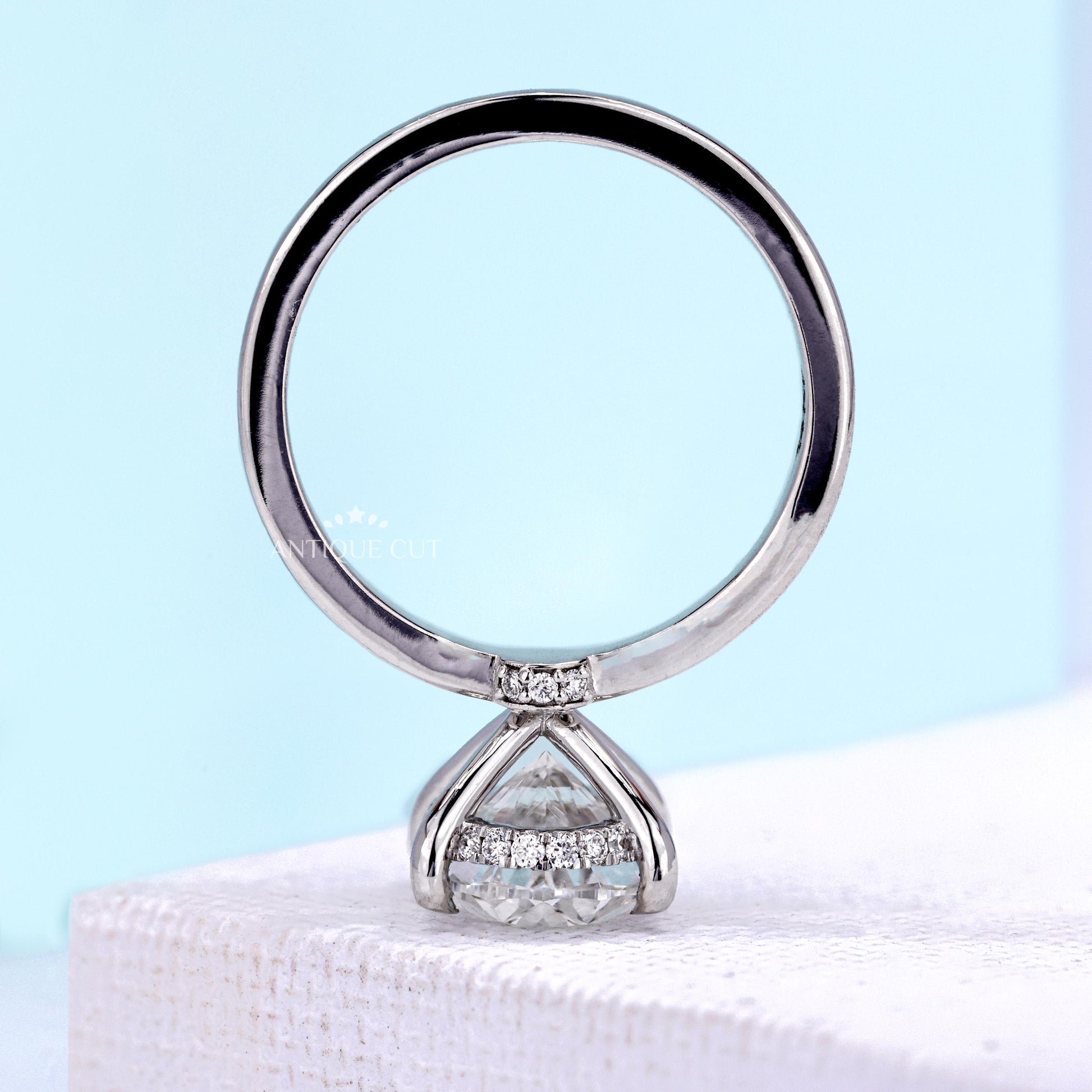 Oval center stone engagement ring with secure claw setting