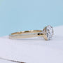 East west oval ring with half bezel setting and yellow gold design