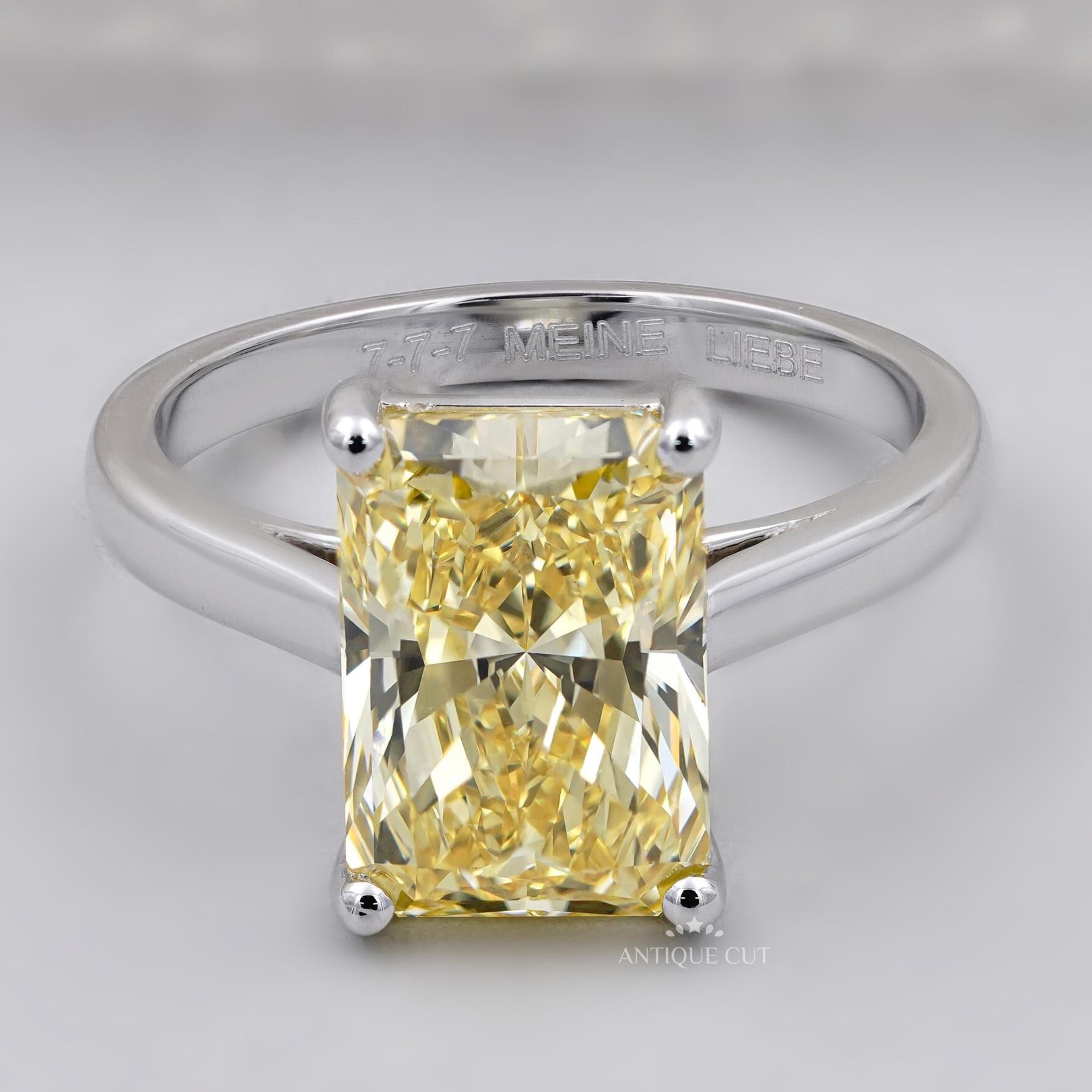 Fancy yellow radiant cut diamond solitaire engagement ring white gold