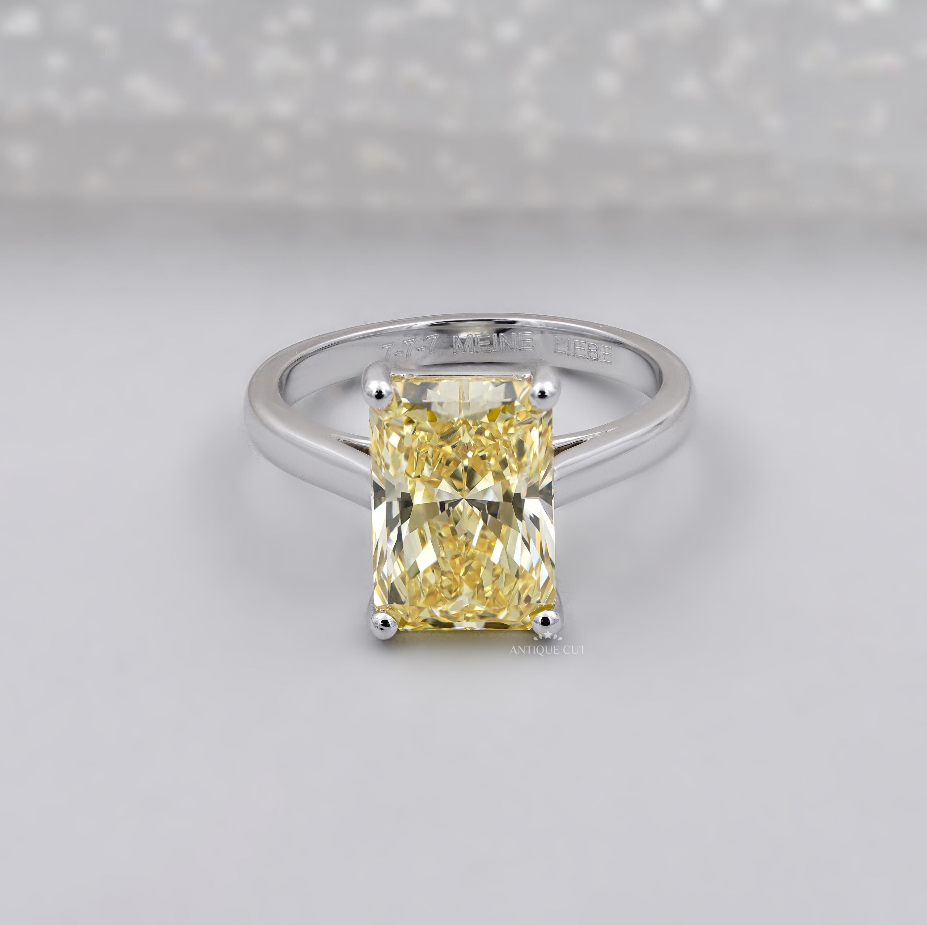 Fancy yellow radiant cut diamond solitaire engagement ring white gold