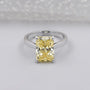 Fancy yellow radiant cut diamond solitaire engagement ring white gold
