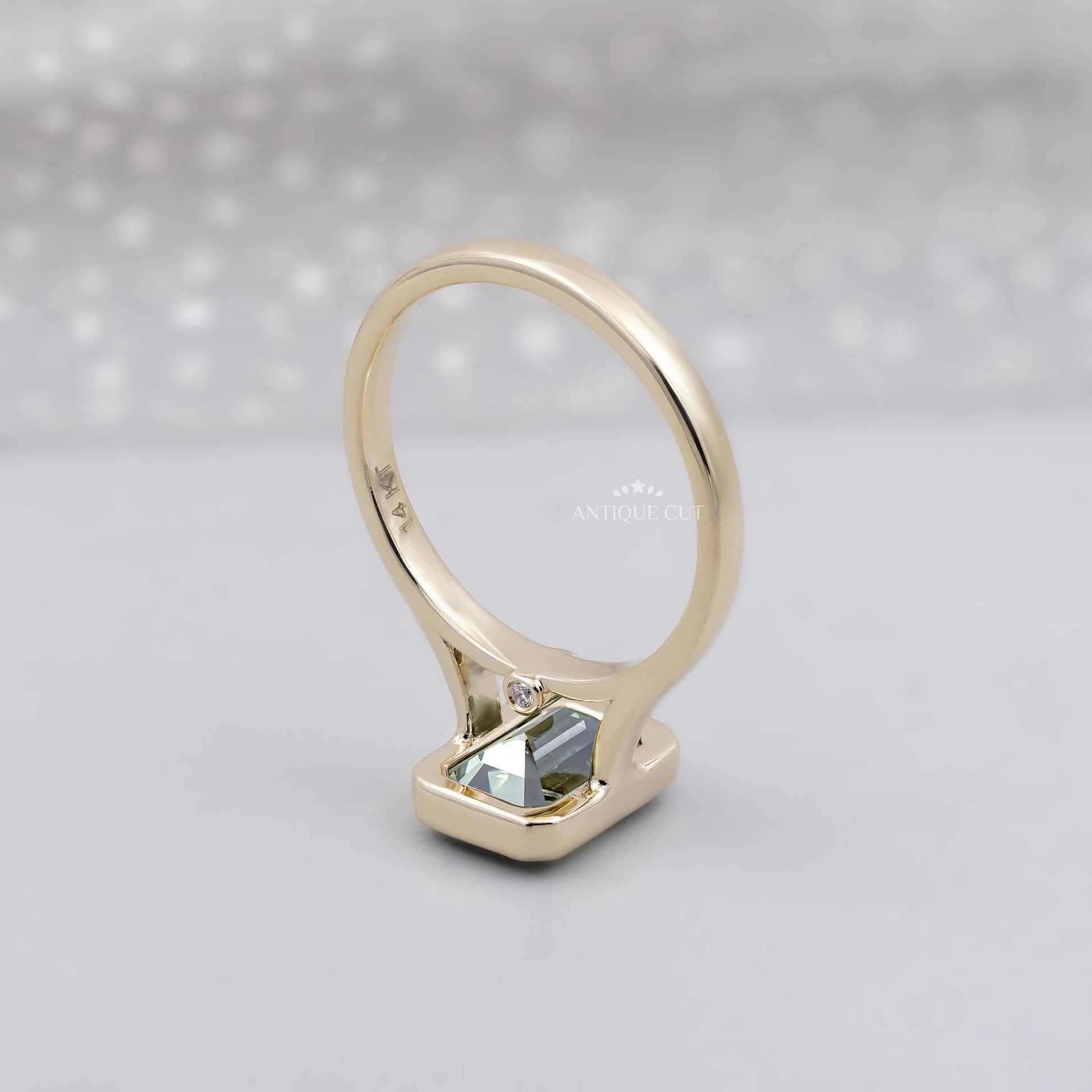 Bezel set green sapphire engagement ring