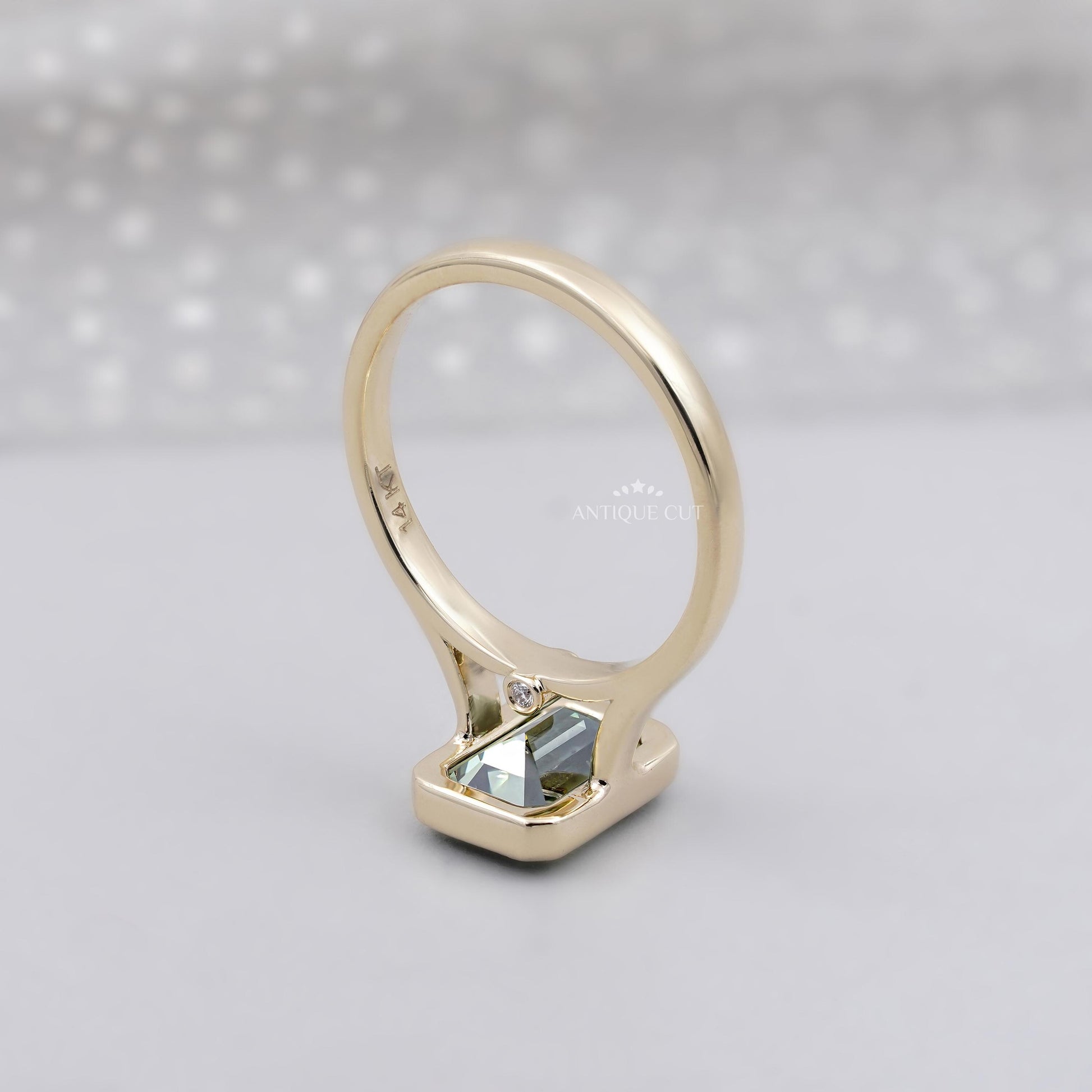 Lab grown diamond green sapphire engagement ring in yellow gold