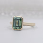 Green sapphire emerald cut bezel engagement ring