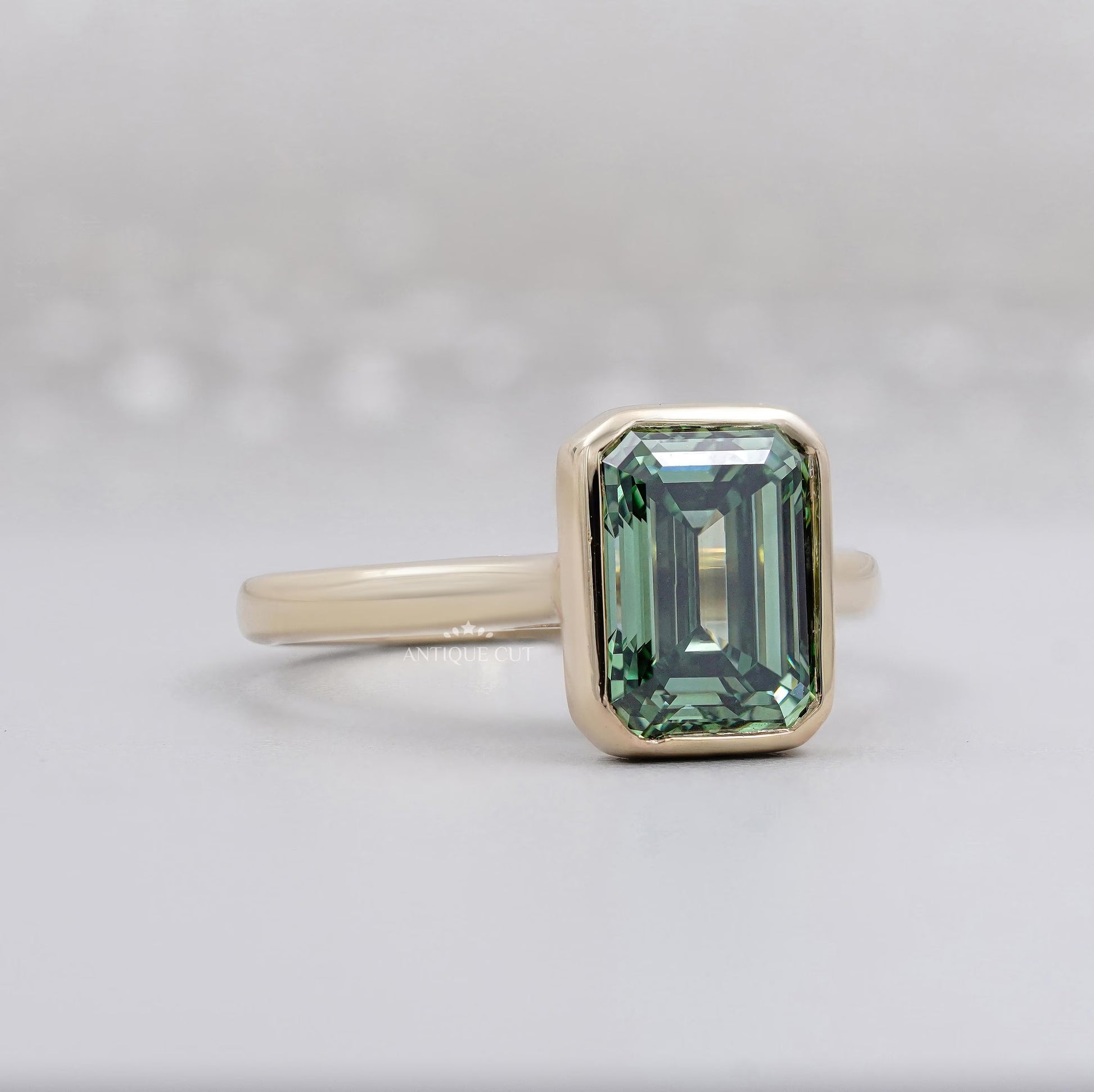 IGI Certified emerald cut green gemstone bridal ring