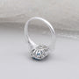 White gold blue topaz engagement ring with halo