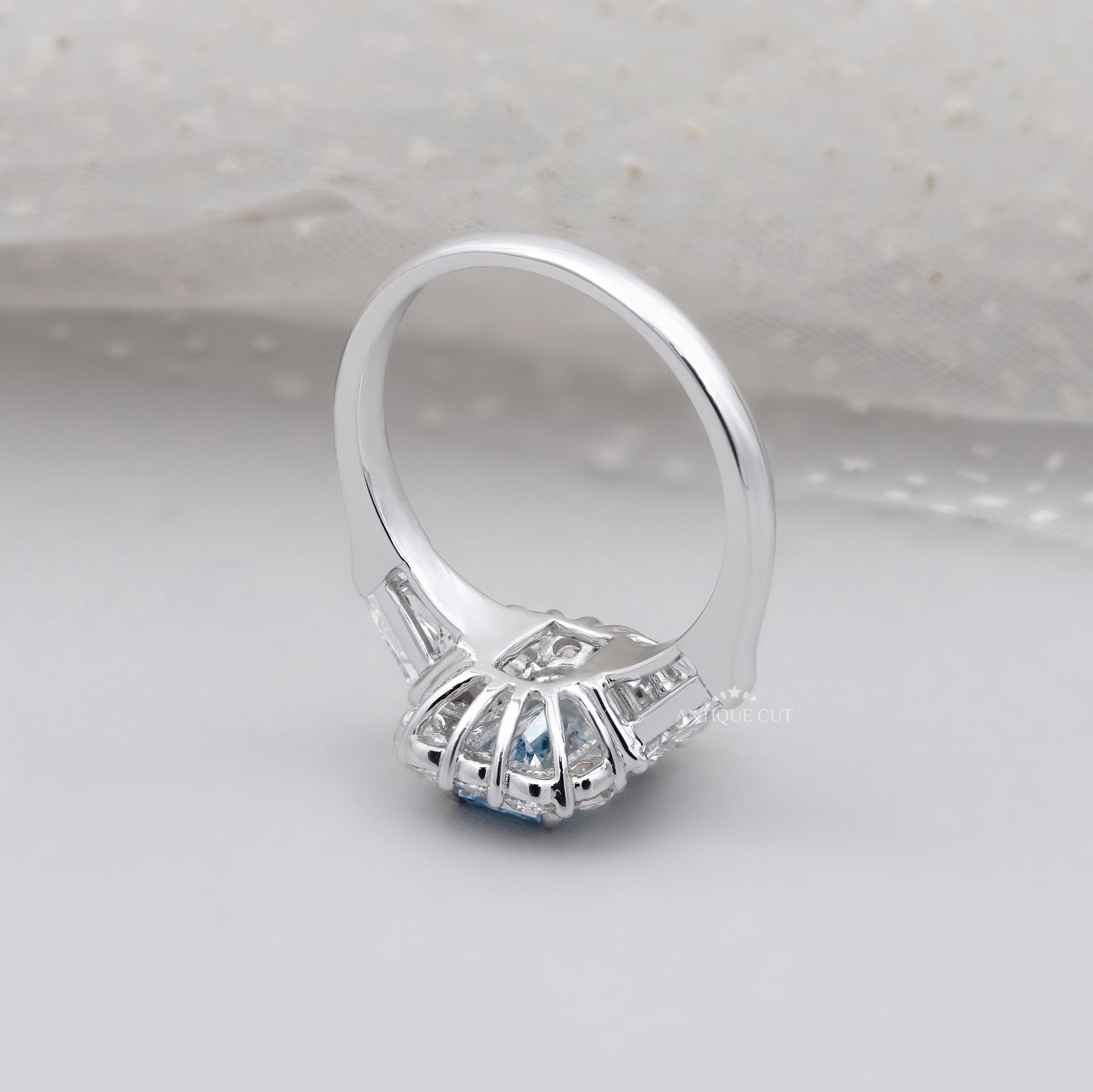 White gold blue topaz engagement ring with halo