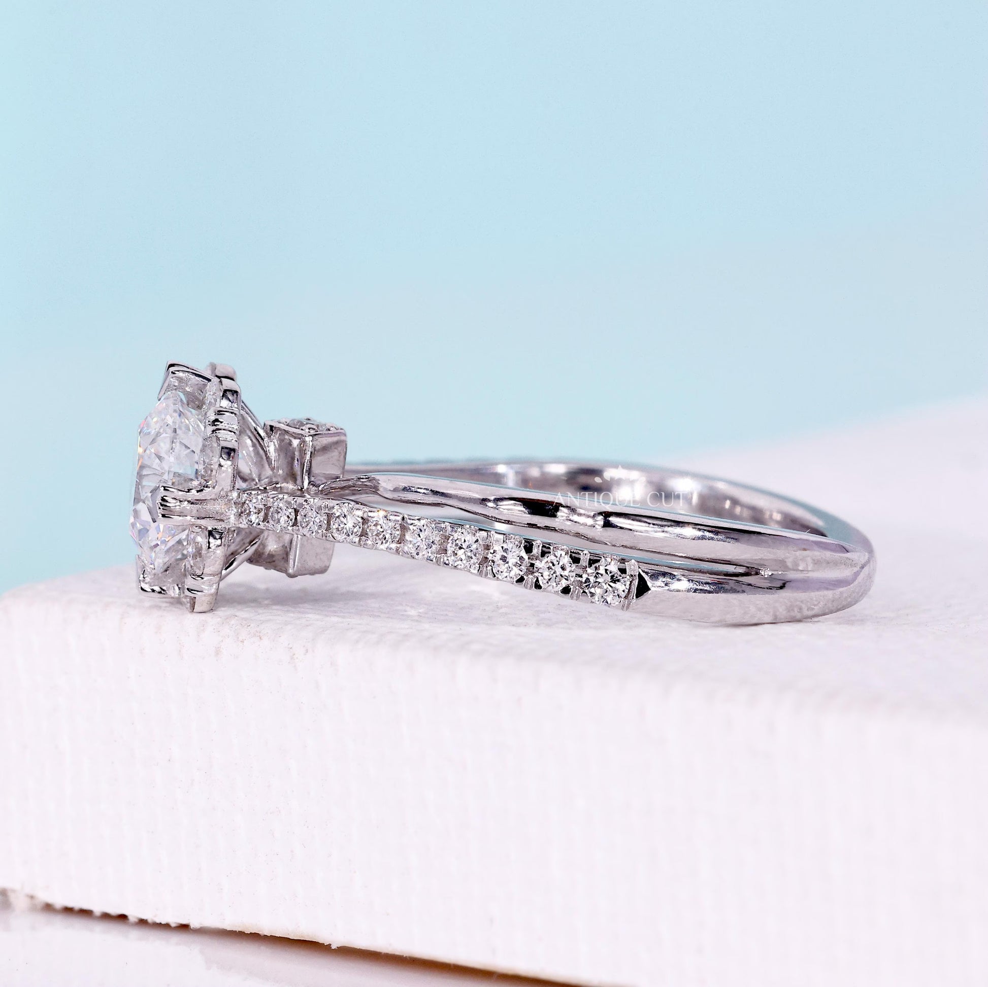 Lab grown round diamond halo ring with pave twist band