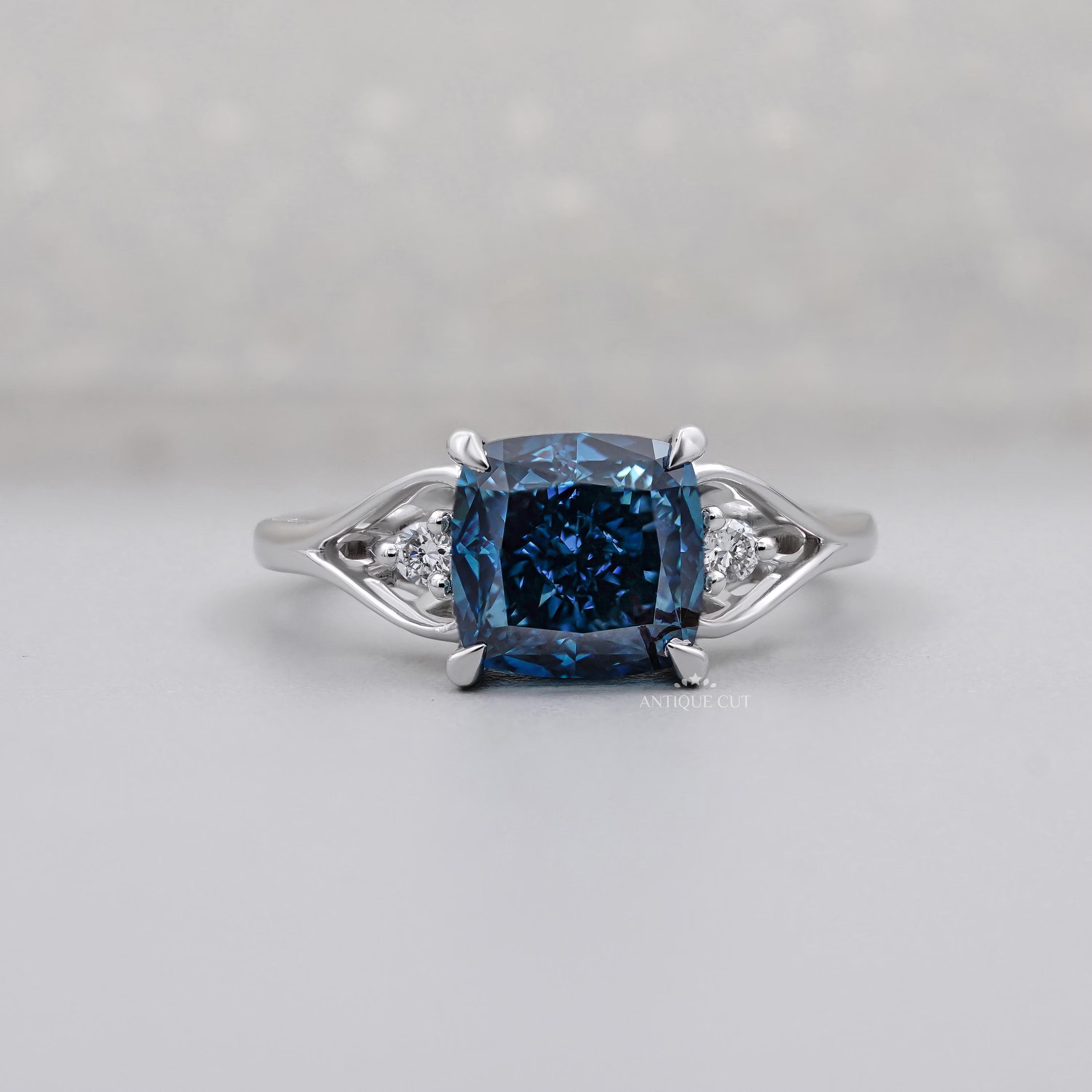 Cushion Cut Fancy Blue Engagement Ring with Round Diamond Side Stones IGI Certified