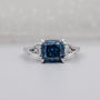 Cushion Cut Fancy Blue Engagement Ring with Round Diamond Side Stones IGI Certified