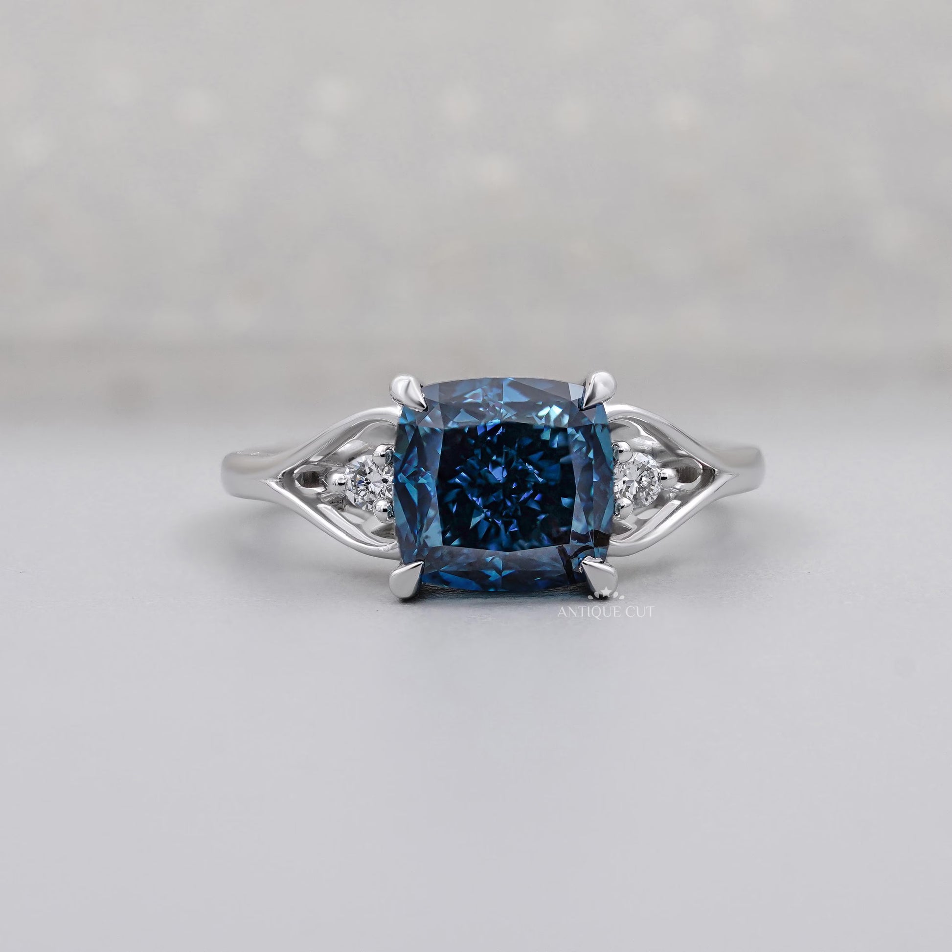 Cushion Cut Fancy Blue Engagement Ring with Round Diamond Side Stones IGI Certified