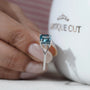 Proposal ring cushion cut blue diamond with side diamonds