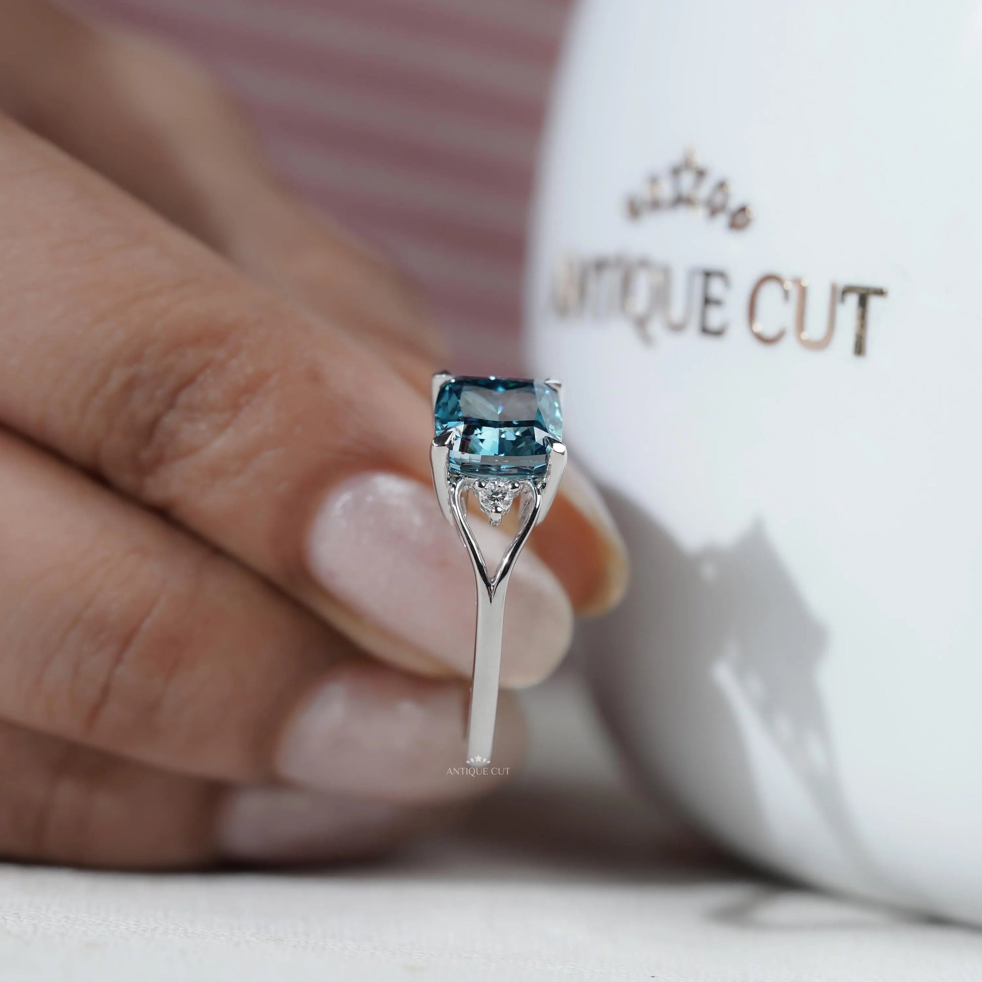 Proposal ring cushion cut blue diamond with side diamonds