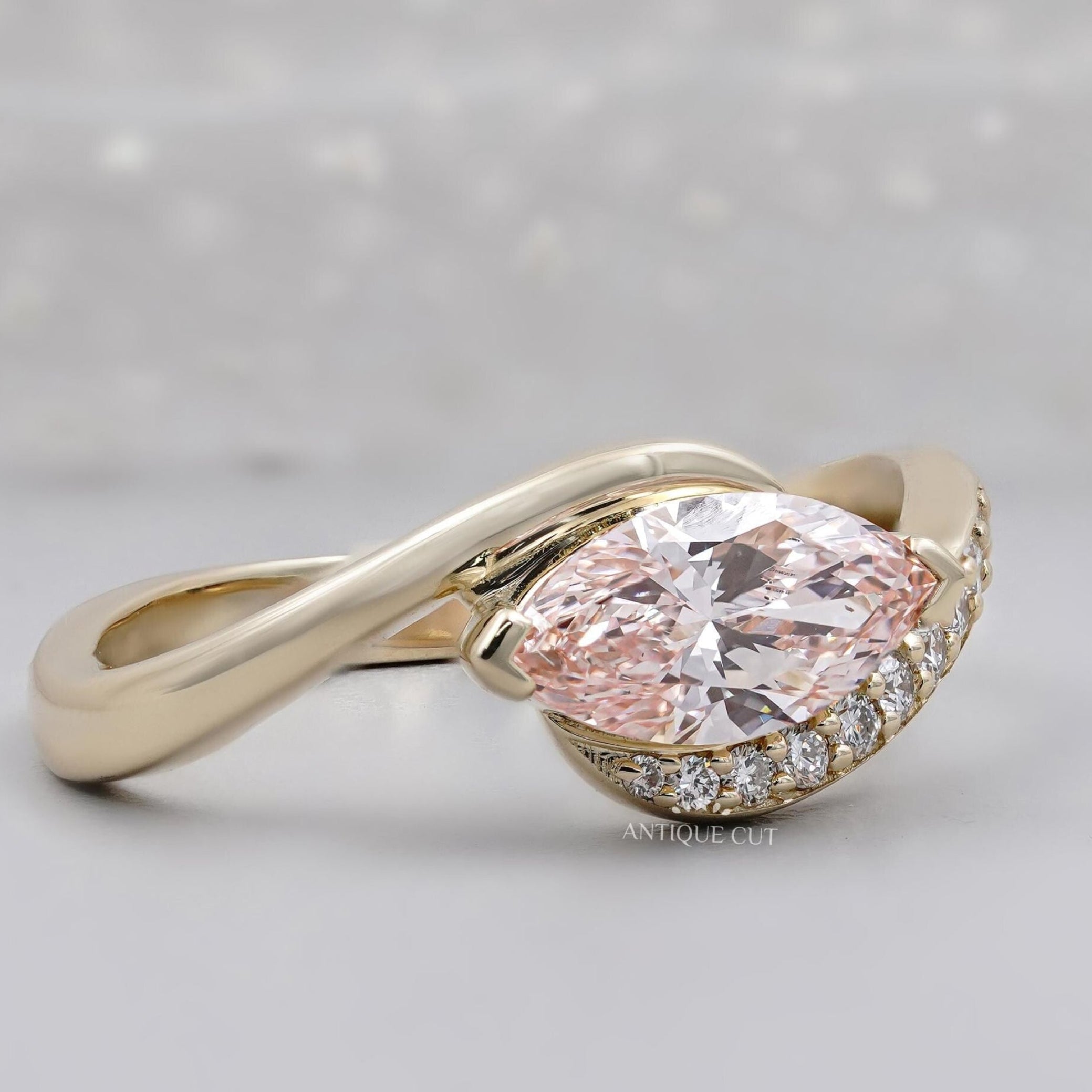 Marquise pink diamond engagement ring with bypass design